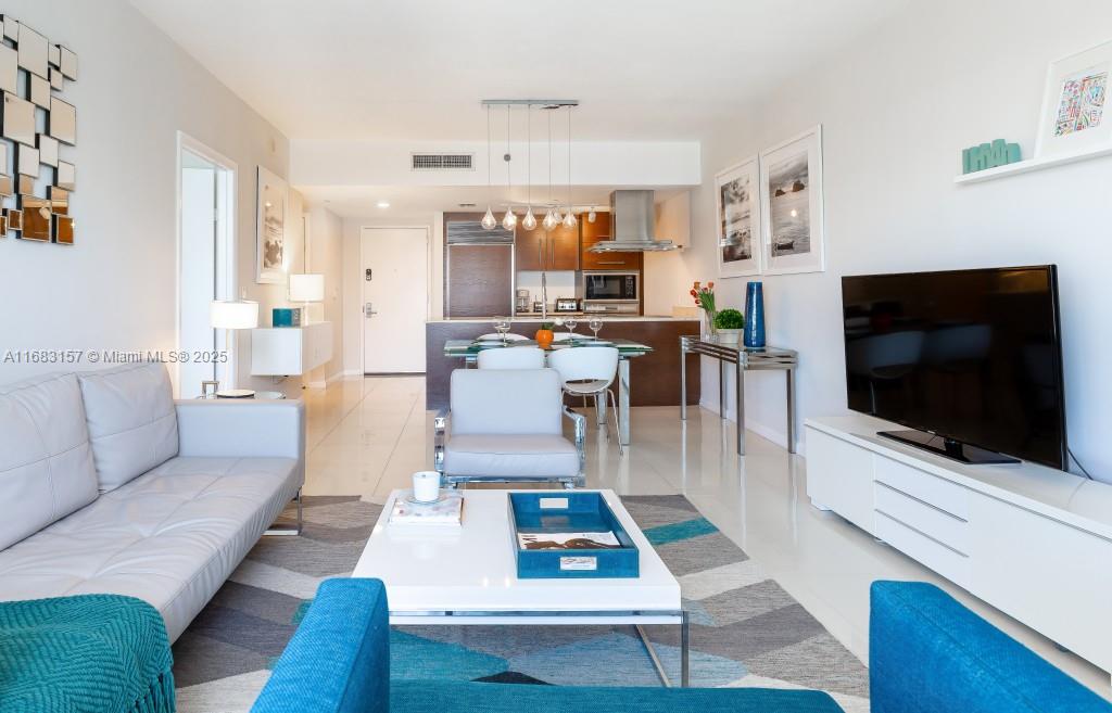 On a high story, with floor-to-ceiling glass walls, this condo offers stunning city and river views with the bay in the background. Completely remodeled, furnished and equipped, with one queen-size sofa bed in the living room, with a fully equipped kitchen with Bosch dishwasher, full-size washer/dryer, 2 HD Smart LED TVs, Italian cabinets, and premium appliances by Wolf & Subzero, marble counters. it is ready to start producing money from day one.