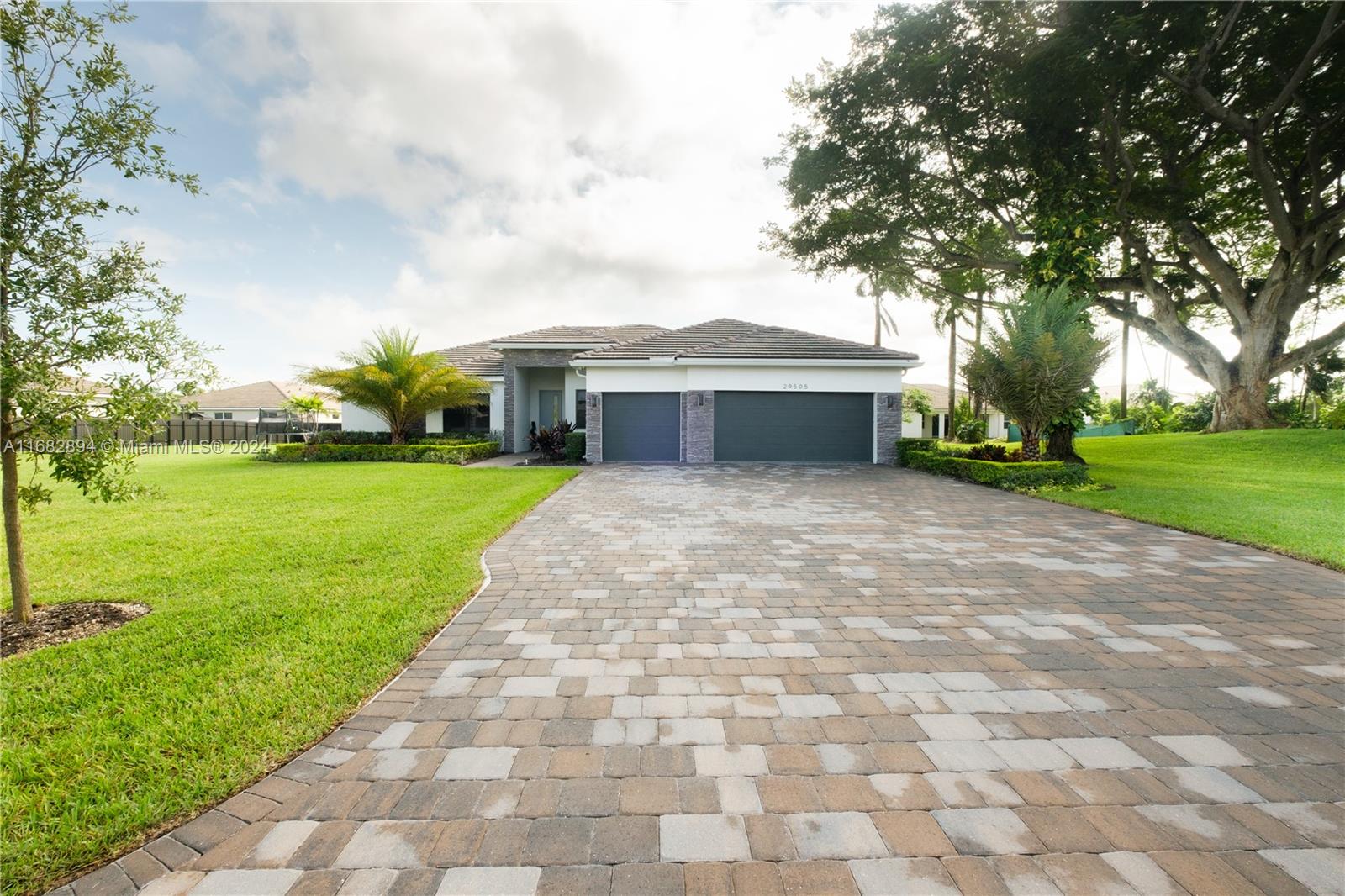 Welcome to this beautiful single family home, nestled in the heart of Homestead, Florida. This inviting, newly constructed home -less than two years old- offers a blend of comfortable living with the beauty of natural landscape and a historic Wild Tamarind Tree! Set on an ENORMOUS 30,000 Sq.Ft Lot, the residence boasts lush greenery and ample outdoor space, perfect for enjoying South Florida's warm, sunny climate. 

Inside, the home features an open layout that maximizes space and flow, with generous natural light streaming through every room. Living areas are designed for both comfort and style. Kitchen is a standout, equipped with quality appliances and plenty of storage. The Property also includes a three-car garage and ample parking space.

This is more than a home; its a LIFESTYLE