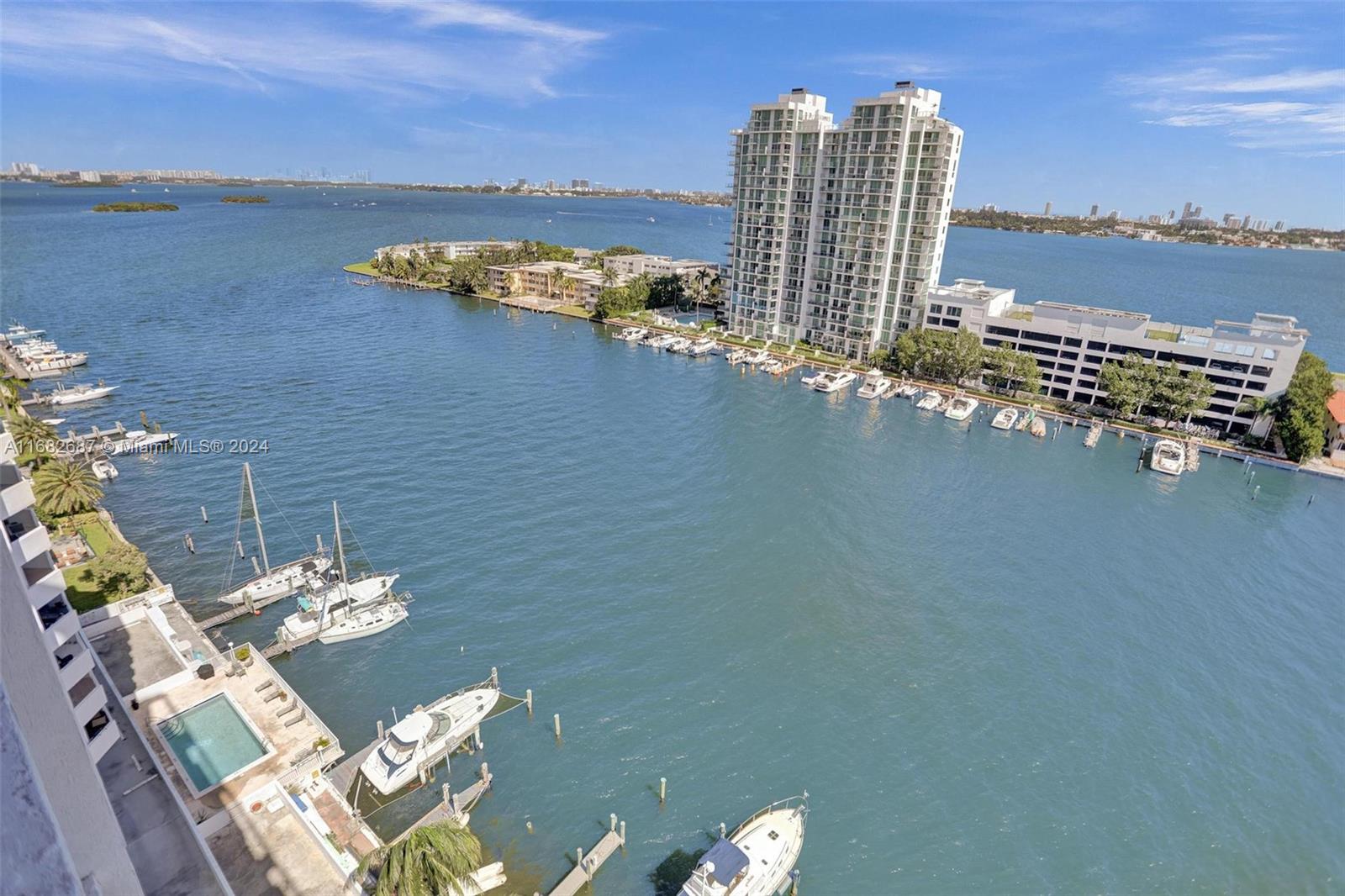 Experience serene island living in a modern 2-bedroom, 2-bathroom, built in 2005, nestled in North Bay Village. NBV consists of 3 islands near Miami Beach. Stunning bay views, this residence features east sunrise views, natural light throughout, impact windows, two dedicated parking spaces, and a rooftop pool with panoramic water and city views plus a gym and sauna. Located on a peaceful island, this home offers a perfect blend of relaxation and convenience, minutes from Miami’s vibrant dining and shopping. Invest in the future of luxury waterfront living; Publix, hotels, restaurants and more coming to NBV. (HOA amount includes reserves)