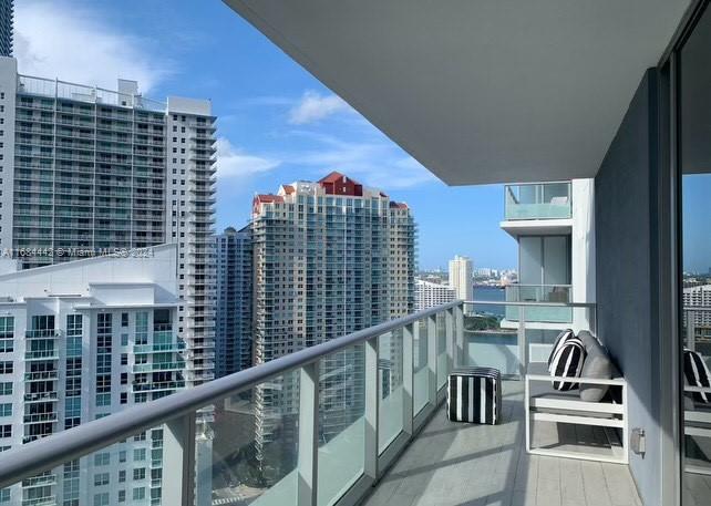 Discover this stunning largest studio floor plan in Brickell House located in the heart of Brickell featuring beautiful city and partial water views. This fully remodeled unit boasts modern finishes, a spacious built-in walk-in closet and a stylish bathroom. Enjoy the convenience of an in-unit washer and dryer. The large balcony is perfect for relaxation or entertaining. With a rental policy allowing leases of just 30 days or more, this unit offers excellent investment potential.