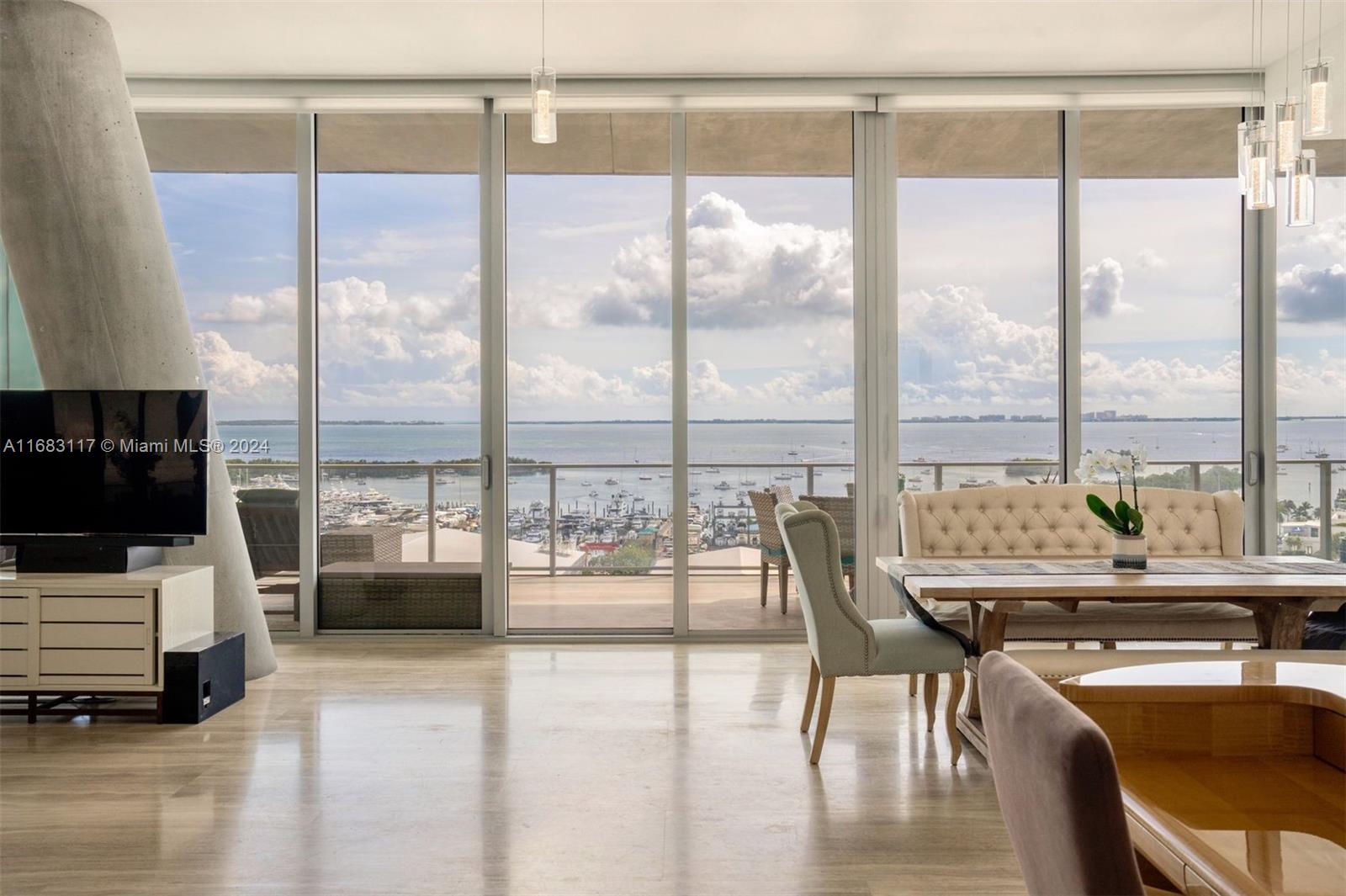 Rare, split-level in ultra-luxury Grove at Grand Bay! Unobstructed views of Biscayne Bay & downtown. Featuring a private elevator, expansive living & dining room, sprawling 2400 SF interior & 1000 SF in private terraces, 12-ft ceilings, marble flooring, custom closets, chef’s kitchen w/ Miele appliances & gas cooking, outdoor kitchen w/ grill & 2 bar fridges, Duravit fixtures & automated shades. Upper level primary suite with deep soaking tub & rainfall shower.  Bonus den/nanny quarters with an ensuite full bath. This truly white-glove condo offers 3 acres of lush grounds, valet, 24-hour concierge, rooftop swimming pool, 75-ft lap pool, fitness center, spa, pet spa, dining room with private chef & catering, library, Tremble Pilates, & kid’s playground.