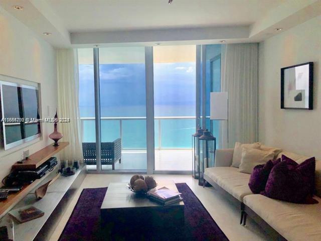 Live at most prestigious Jade Ocean, right on the beach of trendiest Sunny Isles. This unit's perfect floorpan features exceptional master bedroom with walk in closet and most spacious and beautiful master bathroom; calacata marble floors throughout, and state of the art kitchen equipment. Convenient den converted into second bedroom and private laundry room. Huge terrace with breathtaking views of the ocean invite to enjoy privileged beach services, sunrise and sunset impressive pools, 2 hot tubs, excellent spa plus one of the best equipped gym rooms in the real estate market . Concierge service, day restaurant and more