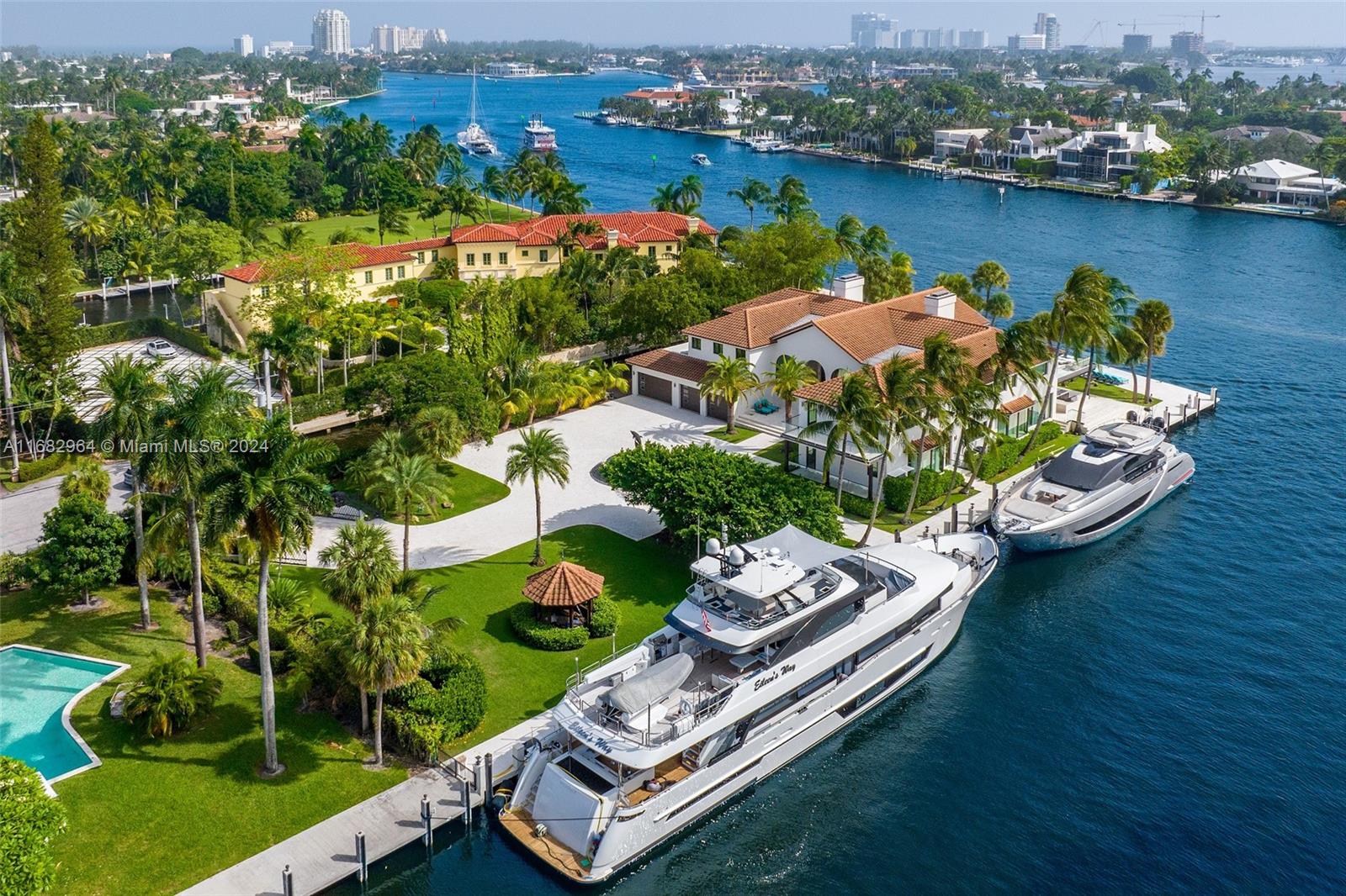 Bontona Peninsula stands as a rare jewel on nearly one acre in Las Olas Isles, with ~700 ft of deep-water frontage and spectacular views along the New River. This gated estate spans 10,259 SF, featuring six lavish bedrooms, nine full baths and a 3,000-SF primary suite with dual closets, a morning bar and a private terrace. Designed by Katia Bates, the interiors showcase book-matched marble floors, custom Pecky Cypress entry door and semi-precious stone countertops. The chef’s kitchen, paired with a catering kitchen, caters to grand entertaining. Outside, enjoy an infinity pool, expansive terraces, and dockage for a superyacht. Bontona Peninsula delivers privacy, luxury, and breathtaking views, offering a once-in-a-lifetime opportunity to own one of South Florida’s most prestigious estates.