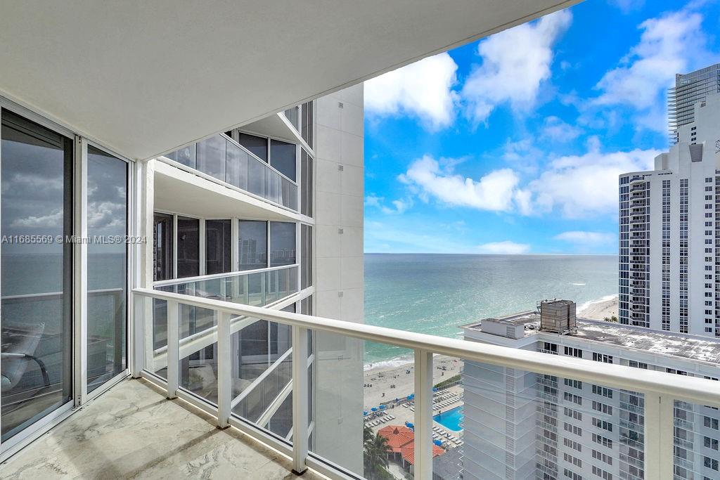 Welcome to oceanfront living at its finest! Opportunity to live in a condo that provides breathtaking panoramic views of the beach, city skyline, and intercoastal waterways. The unit features a DEN, private foyer & 2 en-suite bedrooms. Awaken each morning to the shimmering sunlight on the ocean and indulge in the finest sunrises and sunsets Florida has to offer right from the comfort of your own home. This is more than just a home; it is a true resort-style oasis, complete with a private restaurant, 24-hour doorman, beach service, tiki huts for entertaining guests, playground, dog park, 2 tennis courts, valet service, fitness center, spa including a sauna & steam room and more.