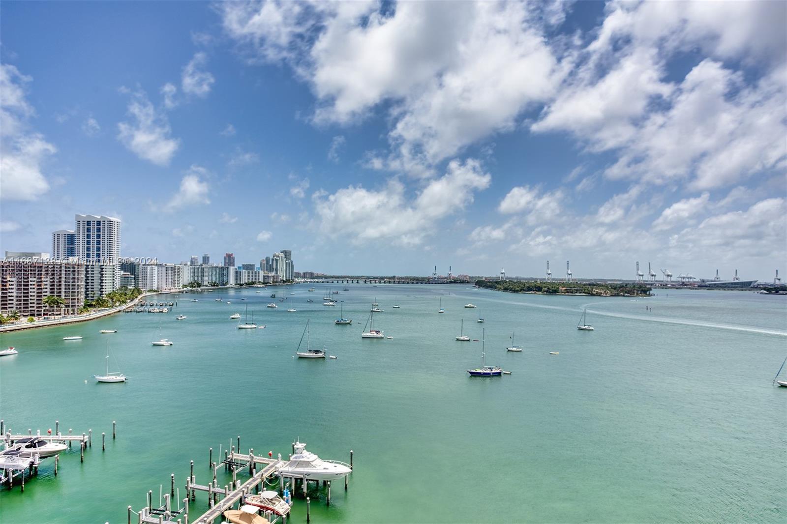 Beautiful views of Biscayne Bay from private balcony and windows of this South Beach luxury rental in full service condominium. Corner unit with 2 large bedrooms with large walk-in closets, 2.5 baths plus a den/home office space, laundry room with washer and dryer. Resort level amenities include heated pool with towel service, 2 tennis courts, BBQ, new fitness center with locker room, massage rooms, 3 Jacuzzis, sauna, 3 hot tubs, party room, restaurant and boat docks with water and electric, 24 hour valet and concierge. A playground and dog park is conveniently located in front of the building. Located on Belle Isle, an easy walk to Lincoln Road and Sunset Harbour restaurants and stores. Cable and internet included. Pet friendly. Assigned garage parking.