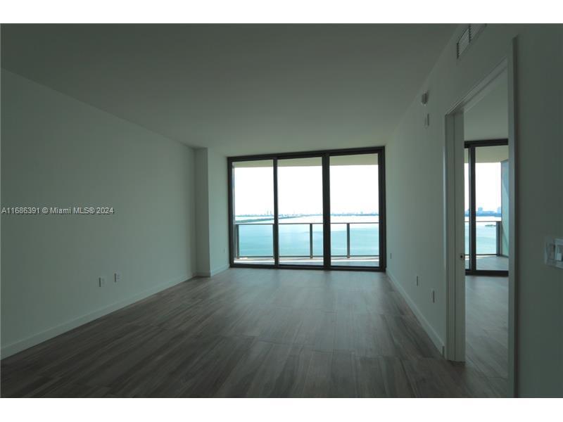 EXPERIENCE ICONBAY CONDO IN EDGEWATER. THIS UNIT IS A 2/2 WITH SEE-THROUGH LAYOUT. GREAT FLOOR PLAN, WOOD PORCELAIN TILE THROUGHOUT, ALL STAINLESS STEEL APPLIANCES WITH W/D IN UNIT. FLOOR-TO-CEILING WINDOWS WITH UNOBSTRUCTED FABULOUS BAY & CITY VIEWS. WATERFRONT DECK FEATURING A SERENE INFINITY POOL, CLUBROOM WITH MULTIMEDIA FACILITIES, BILLIARDS AND GAME ROOM, WATER FRONT FITNESS CENTER & SPA, TENNIS COURTS, 24HRVALET, PARK WITH GARDENS AND WALKING PATH, AND MUCH, MUCH MORE.