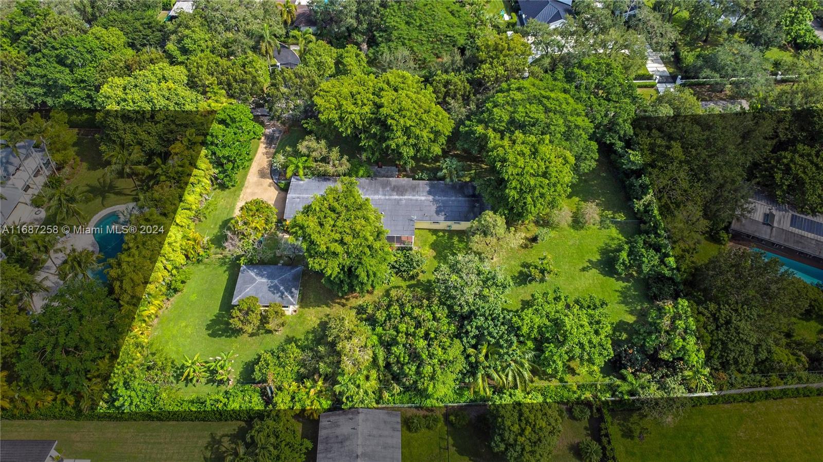 Nestled on a serene, tree-lined side street in the heart of Pinecrest, this one-acre lot with the original 1950's home offers the perfect opportunity to remodel or build your home.  This prime location combines quiet with the benefit of an established neighborhood of stately homes ideal for walking your dogs surrounded by mature landscaping and trees.  Enjoy the beauty of Pinecrest's natural setting, with plenty of space to design a custom estate, pool, garden, and outdoor entertainment areas.  Conveniently located near top schools, parks, and shopping, this property provides a rare opportunity to build a private sanctuary in one of the area's most desirable communities.