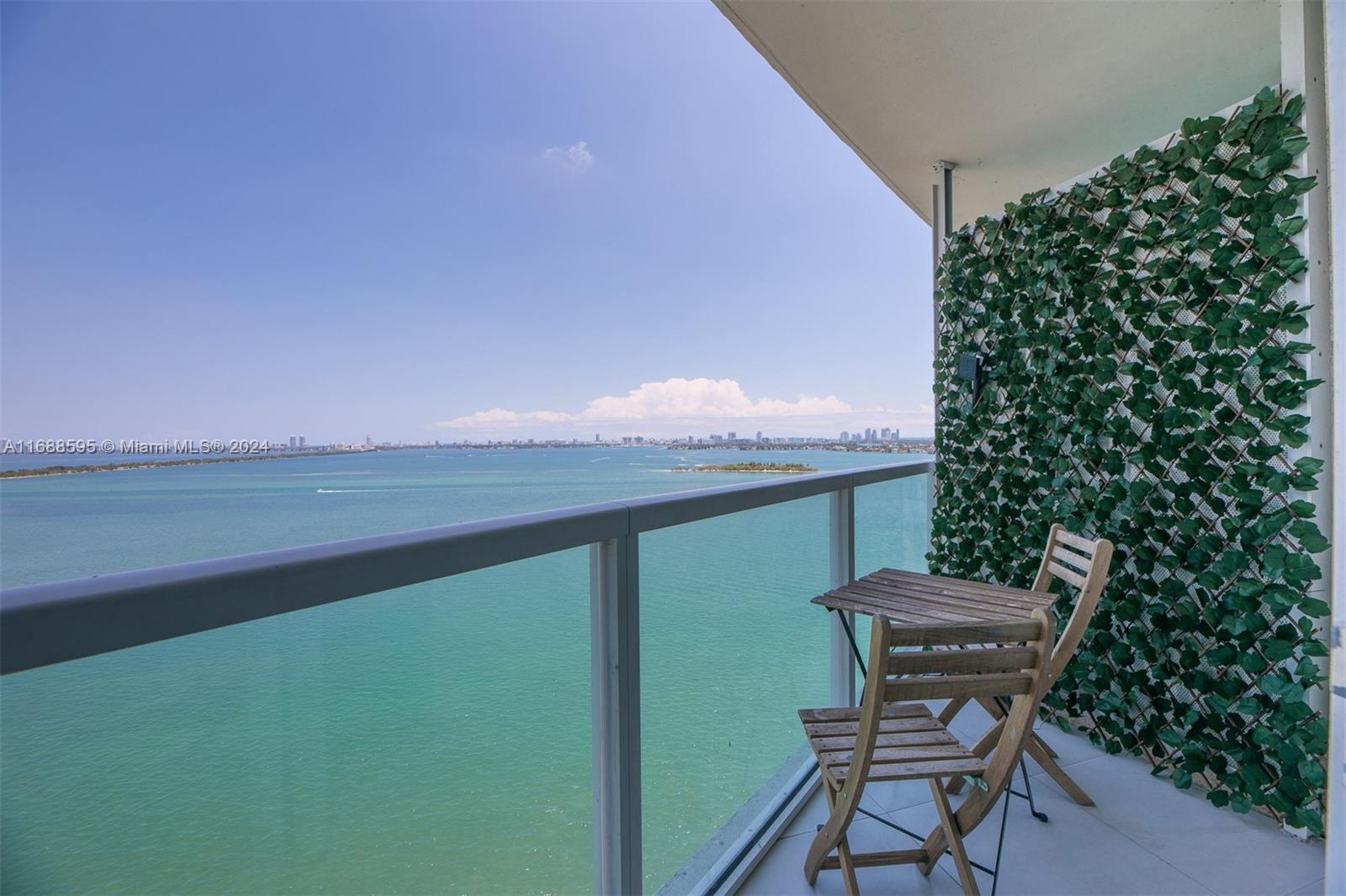 Welcome to Unit 1805 – an ultra-upgraded luxury flow-through residence featuring 2 bedrooms and 2.5 bathrooms within a boutique 28-story building above pristine Biscayne Bay. This exceptional unit spans 1,368 square feet and boasts high-end finishes, including a waterfall island, luxurious marble bathrooms, and upgraded smart lighting. The master suite and second bedroom are retreats with floor-to-ceiling windows that fill the space with natural light. Enjoy two balconies totaling 175 square feet, including a stunning wraparound balcony with breathtaking views of the bay and city skyline, allowing you to experience both sunrises and sunsets from home. Amenities include a renovated infinity-edge pool, spa, sauna, steam room, and a fully equipped fitness center.