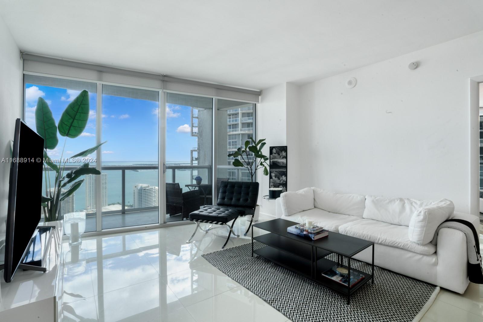 Perched on the 39th floor, this elegant 2-bedroom, 2-bathroom plus den residence in the coveted 07 line at ICON Brickell offers 1,290 SF of sophisticated living space with two expansive terraces that frame sweeping views of the ocean, bay, and city skyline. Inside, enjoy a fully updated kitchen with high-end appliances, abundant storage, new lighting, fresh paint, a new A/C, and a washer/dryer. Floor-to-ceiling windows flood the space with natural light, and spacious closets add convenience to this sky residence. ICON Brickell’s exceptional amenities include a world-class fitness center, lavish spa, three pools, a private dock, restaurants, and a movie theater—just steps from Brickell City Centre, Whole Foods, and fine dining destinations.