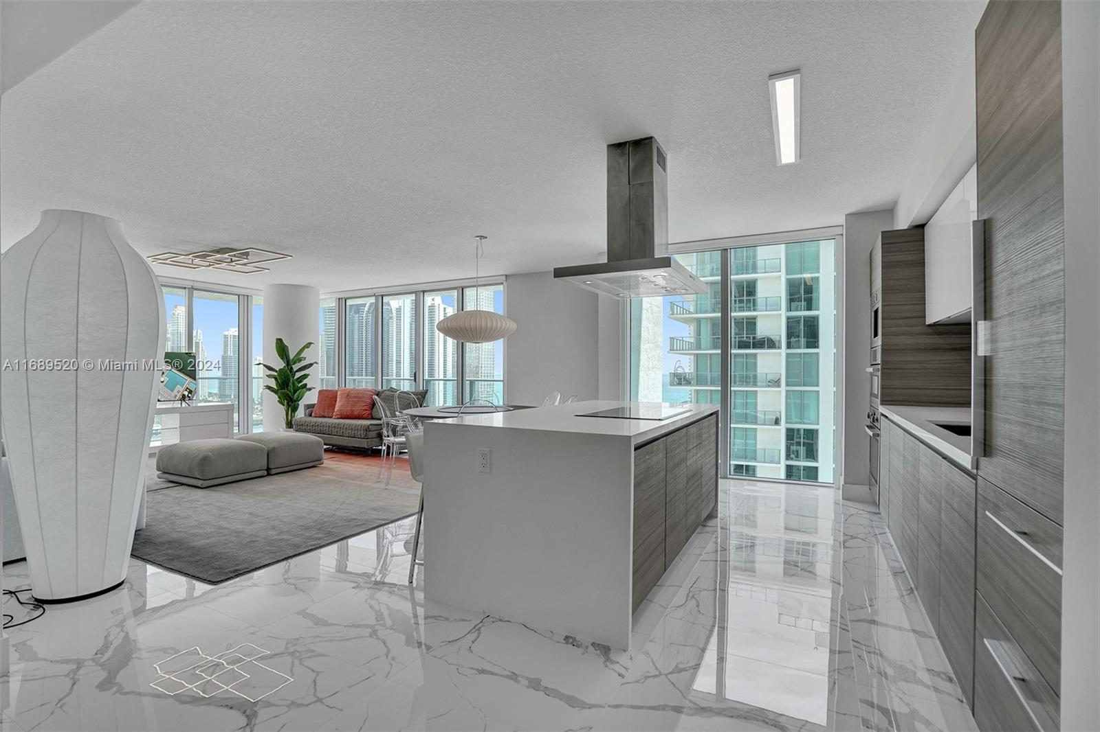 Welcome to an exquisite residence at Parque Towers Sunny Isles. This elegant 3-bedroom, 3.5-bathroom condo offers luxurious living and a sophisticated lifestyle. Fully furnished, it provides a seamless transition for investors or those seeking rental flexibility. Expansive windows showcase breathtaking bay views and flood the space with natural light, creating an open and airy ambiance. Residents enjoy amenities, including a waterfront garden, gym, playroom, game room, and media/recreation room. Active pursuits are supported with a yoga studio and tennis court. Additionally includes a business center, garage, bike room, private storage, and guest parking. Relax in the hot tub or vibrant resident's lounge. Parque Towers offers a perfect blend of comfort, elegance, and investment potential.