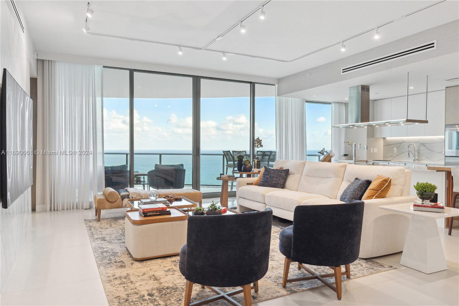 Welcome to this sophisticated, unique and best flow through layout condo at the Ritz Carlton Residences in Sunny Isles. 2800 sqft total area with 10" ceilings! 3 Bedrooms and 3 and half bathrooms, private elevator, Italian designed kitchen,Gaggenau appl, custom made large wine cooler, completely staged and decorated by designer, and fully furnished! Enjoy exceptional sunrise & sunsets views. Enjoy the prestigious and luxury living that the Ritz Carlton Residence has to offer such as state of the art spa, fitness facilities, sky club, media room, two pools sunrise sunset, one private restaurant, 24 hr concierge services, movie theater, spectacular VIP Sky Lounge exclusively for residents with complimentary breakfast on the 33rd floor w/breathtaking Miami skyline views. Guest private suites!