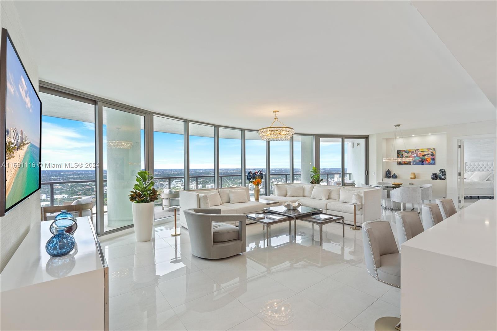 Stunning, furnished 42nd floor condo in 100 Las Olas. Enjoy luxury living in this 2,658 sq. ft residence. 3 Beds + Den & 3.5 Baths. Floor-to-ceiling windows, great natural light, large terraces; spectacular sunsets & river views. Professionally furnished w/designer custom furniture, lighting, marble floors, high-end finishes. Fully equipped gourmet kitchen: European cabinets, quartz counter tops, top of the line appliances. Wet bar & wine cooler. Primary suite features 2 walk-in closets, luxuriously appointed bathroom. 2nd & 3rd bedrooms have ensuite baths, walk-in closets. Laundry room w/ full size washer, dryer. 2 assigned parking spaces included. 5 star resort style amenities: 24/7 concierge front desk, rooftop pool, club room, fitness room, onsite restaurant, valet parking & more.