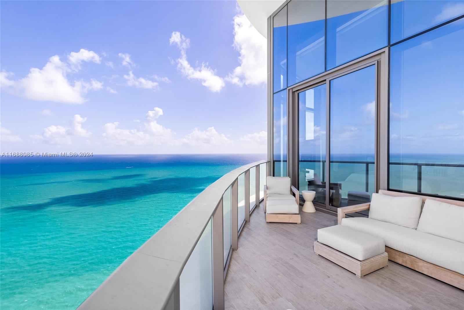 Rarely Available soaring on the 48th Floor, this Unit has been Exquisitely fully remodeled by Interior Designer Graciela Dayan at the prestigious Ritz Carlton Sunny Isles w/ No expense spared. The unit features 3 bed / 4.5 bath,14 ft Cathedral ceilings & expansive terraces. Breathtaking unobstructed panoramic ocean & city views from sunrise to sunset through 14 ft floor to ceiling windows.  Every detail exudes elegance, from the custom Italian millwork & white oak herringbone wood floors to the striking Calacatta Viola marble, custom fireplace & Gaggenau appliances. The Ritz’s signature amenities include: Private Elevator, 24hr Concierge, valet, spa, fitness center, beach/pool svc, 2 pools & restaurant. High end designer fully furnished furniture Is Included. Luxury Living at its finest.