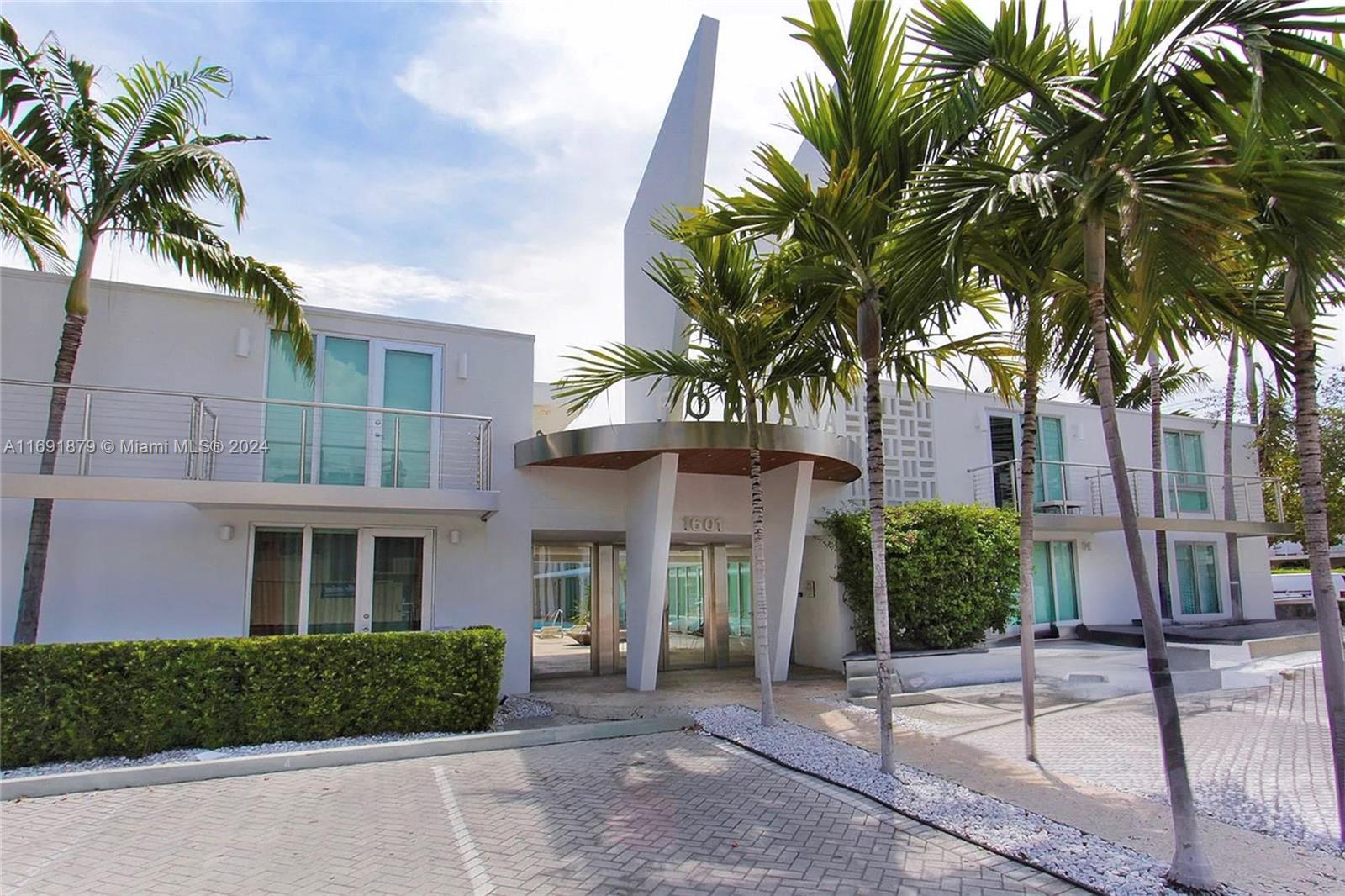 Your South Beach pied-à-terre awaits at the mid-century modern Fontana, an award-winning designed landmark just one block off Lincoln Road. This exceptional unit boasts top-tier finishes, including  teak flooring throughout, a Fisher & Paykel gas range Carrera marble counters & back splash, spa-inspired bath, central A/C, washer/dryer, and impact-resistant windows/doors. Tucked in a private corner, this residence offers heightened seclusion and comes with a private assigned parking spot right by your door. Step outside to enjoy the building's lush central courtyard, complete with a pool and abundant seating. The Fontana's unbeatable address puts the vibrant energy of Lincoln Road, plus world-class shopping, dining and entertainment, all within easy reach. Your new place in the sun begins.