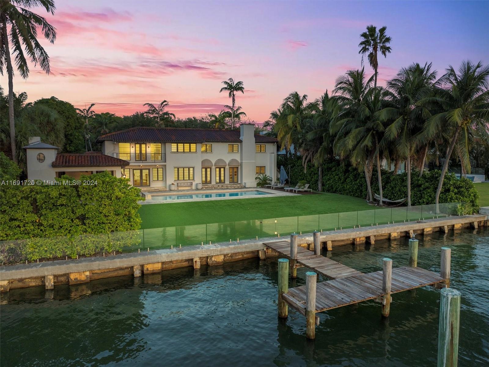 Luxurious waterfront living awaits you in “La Grande Dame,” a magnificent half-acre estate home in the exclusive guard-gated Bay Point community. Commanding sweeping views from an impressive 23,100 SqFt lot (0.53 Acres) with 121’ of Biscayne Bay frontage. This Spanish Mediterranean Architecture residence offers 7 Bed, and 6.5 baths. Set well back from the street, a gated, paver-clad driveway lined with mature oak trees and lush tropical foliage entices you inside. The 2nd floor includes 4 Bed, large den and a generous-size primary suite w/ sitting area, oversized walk-in closet, and 5-piece ensuite. Your outdoor paradise is complete with a pool, summer kitchen, covered cabana and in-ground trampoline. Minutes to Miami Design District, Wynwood, Midtown, Brickell, Airport, and A+ Schools.