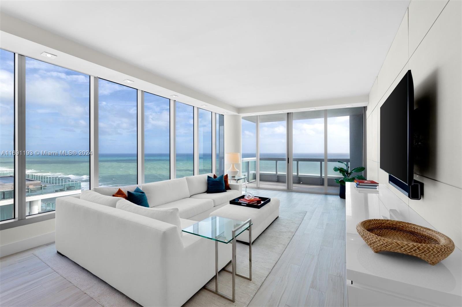 Direct oceanfront residence at the prestigious Carillon Miami Wellness Resort. This 3-bedroom, 2.5-bath, 2,150 sq. ft. corner flow-through offers abundant natural light with ocean and city views. Designer-finished with high-end materials, featuring a reconfigured kitchen, upgraded lighting, automatic window treatments, trimless doors, custom millwork, and built-ins. Enjoy wellness amenities, including a beach club membership, world-class spa with advanced skincare, anti-aging, and restorative treatments. Benefits include group fitness classes, pool and beach service with loungers and umbrellas, wellness workshops, 24-hour concierge, valet, butlers, 4 pools, dining, salon, boutique, and more.