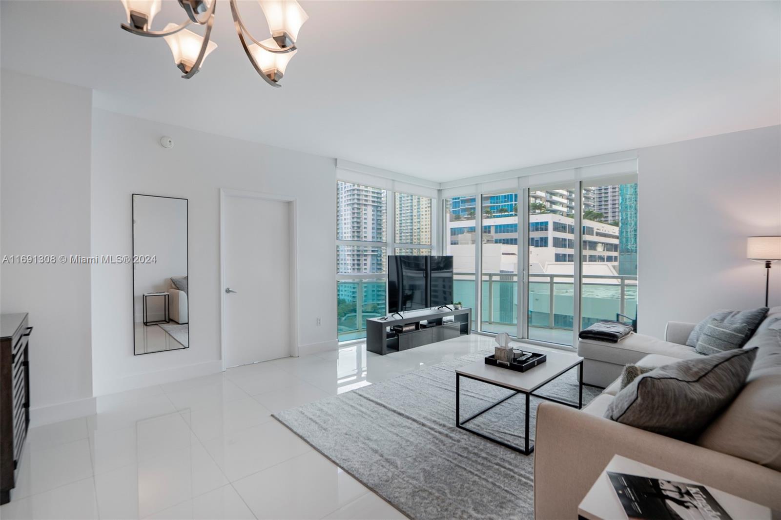 Welcome to this large corner unit in the Plaza Brickell! Best line in the building, rarely available. Just bring your toothbrush, fully furnished. Split floor plan with water and city views and wrap around balcony. Sunlight from every room. Full-service amenities in one of the most luxurious buildings of Brickell! Walking distance to all of the best restaurants/shops Brickell has to offer.