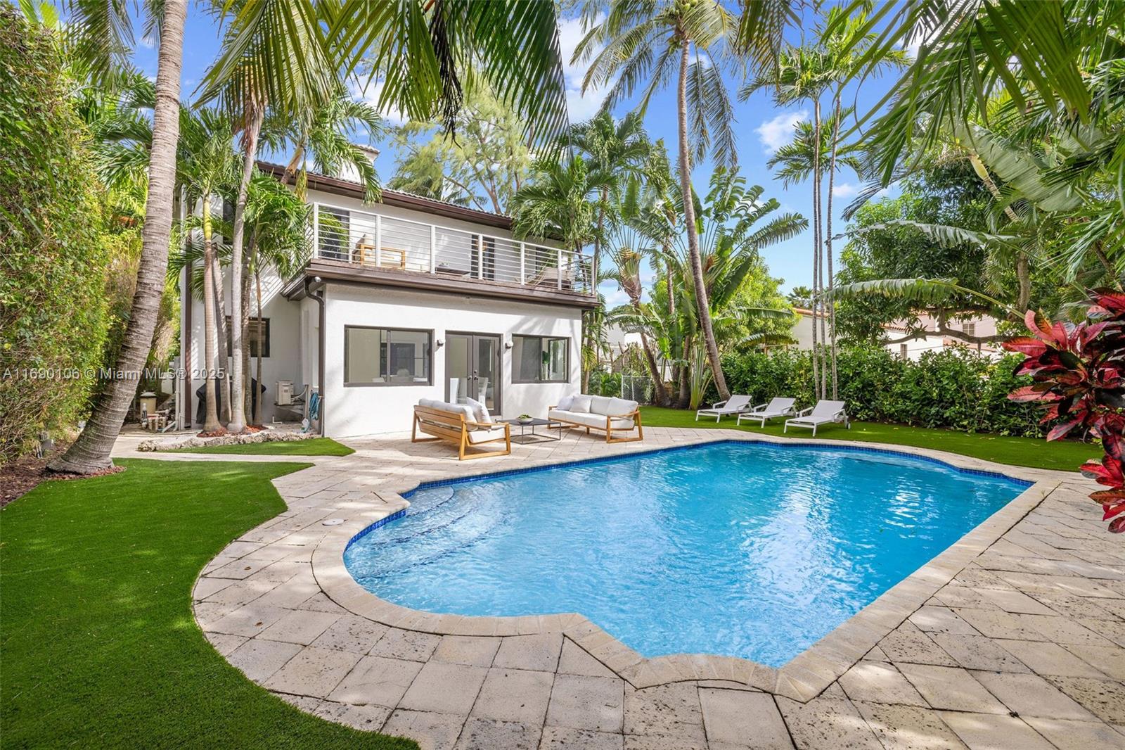 A beautiful Mediterranean residence in the heart of Miami Beach! The heart of the home is the newly renovated designer kitchen, featuring stylish checkered floors and a walk-in pantry, flowing seamlessly into the dining/living area overlooking the inviting pool. Step outside to discover a generous, private pool area surrounded by lush foliage, perfect for outdoor gatherings. On the main level, you'll find a bedroom, an office, and a versatile playroom or guest room, ideal for entertaining or visitors. Upstairs, 3 generously sized bedrooms with ensuite bathrooms await, 2 of which open to a large balcony with serene views and natural light. The home boasts all-new appliances, impact windows, and a new roof, offering peace of mind for years to come. Approx sqft per owner is 2,759.