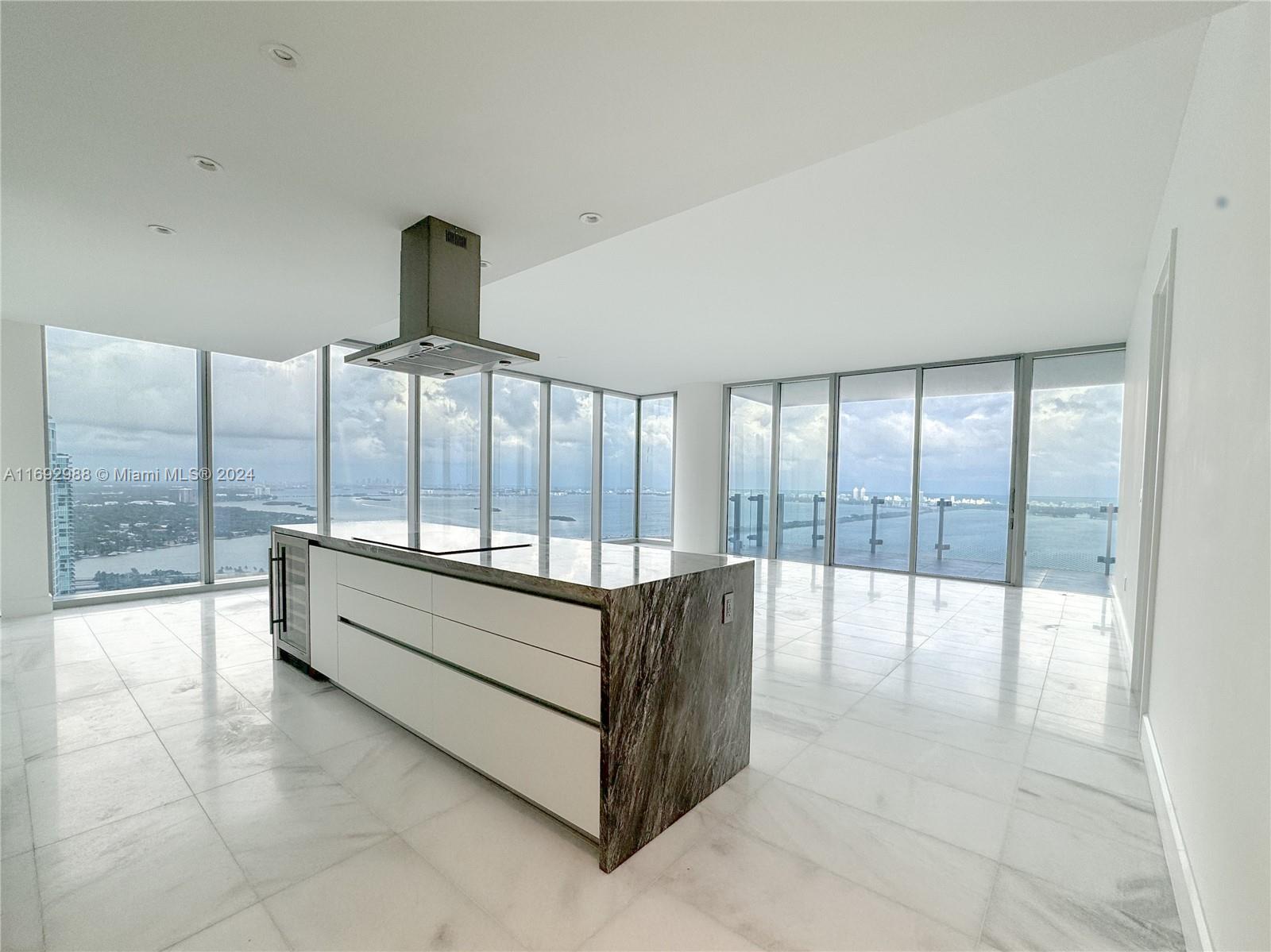 This expansive residence offers breathtaking unobstructed ocean, bay, and city views. With 3 bedrooms, 4.5 bathrooms, full laundry room/or office, this home provides ample space for comfort and luxury. The open floor plan showcases polished marble floors and 10ft floor-to-ceiling windows, filling the living area with light and stunning views. The kitchen is equipped with premium WOLF and Sub-Zero appliances, custom-designed European Italkraft cabinetry. This residence also includes private elevator access, valet/garage access, custom built closets, and world-class amenities. Located just five minutes from the Design District, Miami Beach, Downtown, and Brickell.