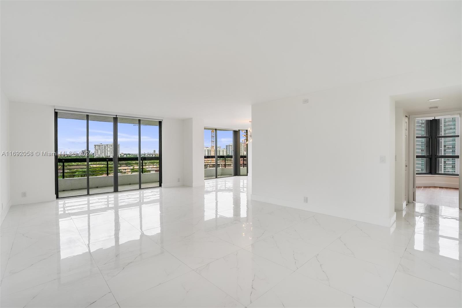 Step into your stunning condo at Mystic Pointe in Aventura! This large corner unit boasts 1,464 sq ft of bright, natural light, featuring 2 beds, 2 baths plus Den, updated porcelain flooring in living areas, privacy shades throughout, blackout shades in bedrooms & a versatile den/dining area w. views of the Intracoastal. Enjoy breathtaking water views from your private balcony & a spacious kitchen w. breakfast nook. Primary bedroom has an ensuite bathroom w. a separate shower & tub, walk-in custom closets. Floor plan includes a 2nd bedroom w. a custom closet & an in-unit washer/dryer. Amenities include fitness center, heated pool, library, tennis/pickleball/basketball courts. Situated on the Intracoastal Waterway & just a 10-minute drive to the beach & less than a mile from Aventura Mall.