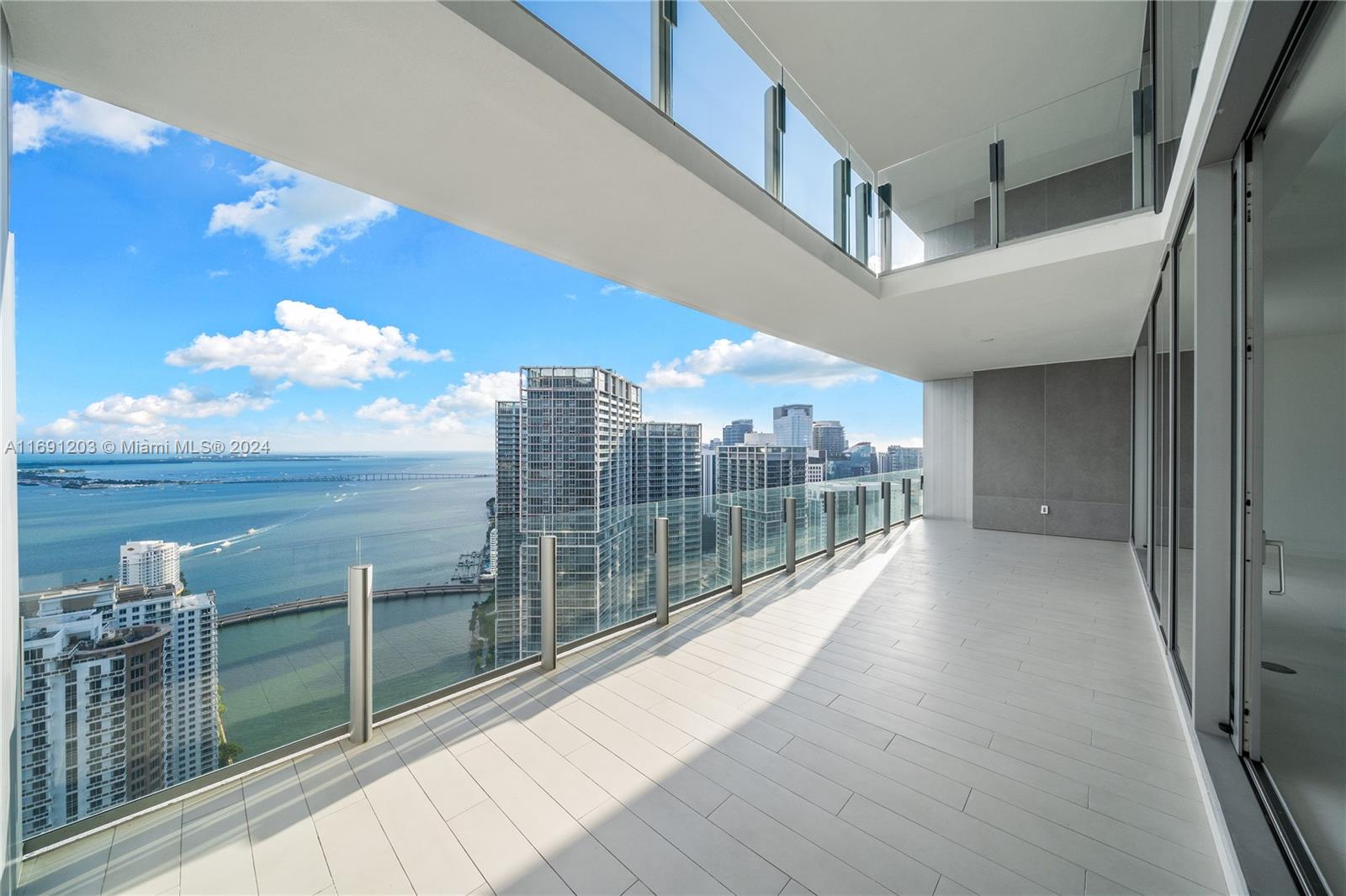 Sky Villa 4802 DUPLEX. Located in the 48th floor (almost above any building in the city), this 1 of 3 impressive, brand-new, doble height ceilings, monumentally spacious residence, offers unparalleled clear blue water views. The 5,079 sqft (472 m2) are configured as 5 bedrooms + Family + Den + Laundry room, but can be converted into a 6 or 7 rooms apartment. It includes 2 enormous terraces facing directly the Ocean (one is private & exclusively for the main bedroom). Top of the line european appliances (Gaggenau), spacious & fully equipped kitchen including a floor-to-ceiling wine cellar. Fabulous Master Bath & Dressing room. +42,000 sqft of world-class amenities including Virtual Golf, Movie theater, Iconic pool (55th floor), 2 levels-gym, Spa & Helipad. *Includes 3 independent parkings.