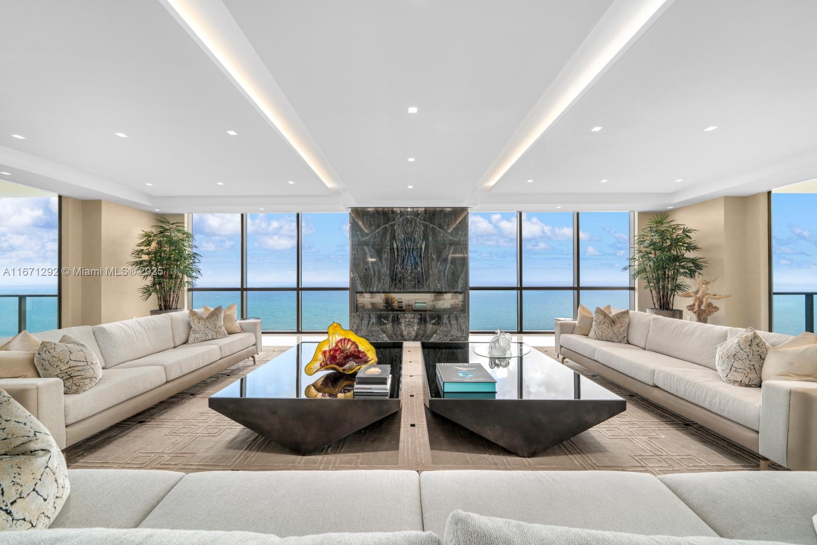 A Masterpiece in the Sky at Mansions at Acqualina. This 10,000+ SF oceanfront residence offers 4 bedrooms, 5 full baths, & 1 half bath, with direct ocean & city-side terraces providing 270° views of the ocean, Intracoastal, & downtown. The Downsview kitchen features a La Cornue range, quartzite counters, & Sub-Zero appliances. Entertain w/ a custom bar showcasing rare Baobab granite, 4 wine refrigerators, & a 600-gallon aquarium. Spa-like bathrooms boast heated floors & exquisite stone work. Smart home automation, custom millwork, & luxurious finishes define every space. Enjoy Acqualina’s world-class amenities, including a private cinema, hammam spa, virtual golf, & a pool deck w/ private cabanas. This residence is the ultimate blend of sophistication, comfort, & oceanfront luxury