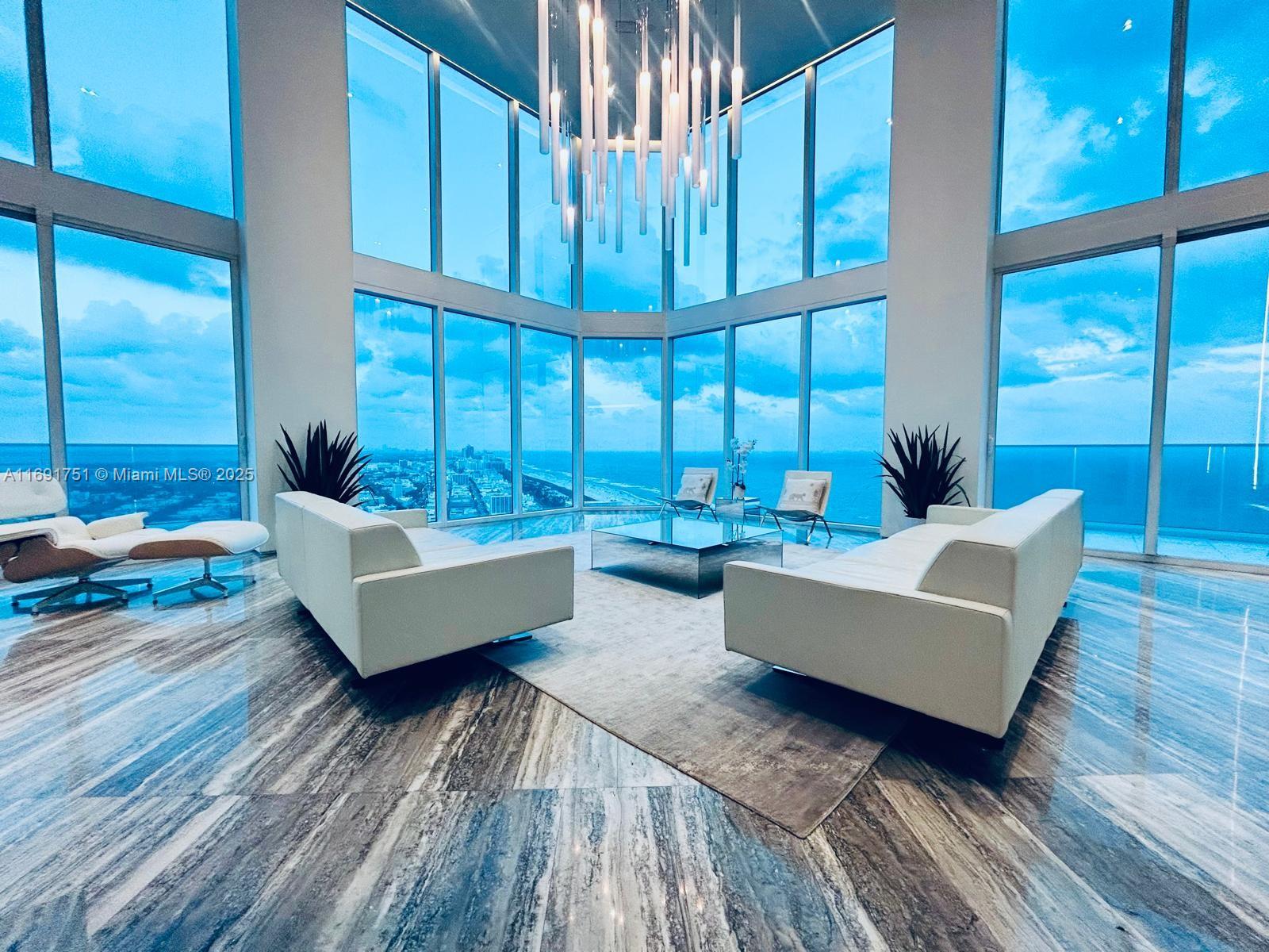 Completely Remodeled ( 4 units combined into 1 Big Penthouse )
 • Views: 360-degree views of Atlantic Ocean, Biscayne Bay, Miami skyline
 • Interior: Industrial/modern design with 18-ft ceilings, silver travertine floors, rare Mikasa wood, and Statuary Marble
 • Luxury Touches: Bank vault-inspired door, backlit Onyx wall, two grand stairways, chef’s kitchen
 • Amenities: Interior elevator, private sauna/steam room, 24-hour security, concierge, pool, spa, fitness studio



Parking 

 • 6 assigned parking spaces, EV charging, covered valet

Additional Details 

 • School Zones: South Pointe Elementary, Nautilus Middle, Miami Beach High