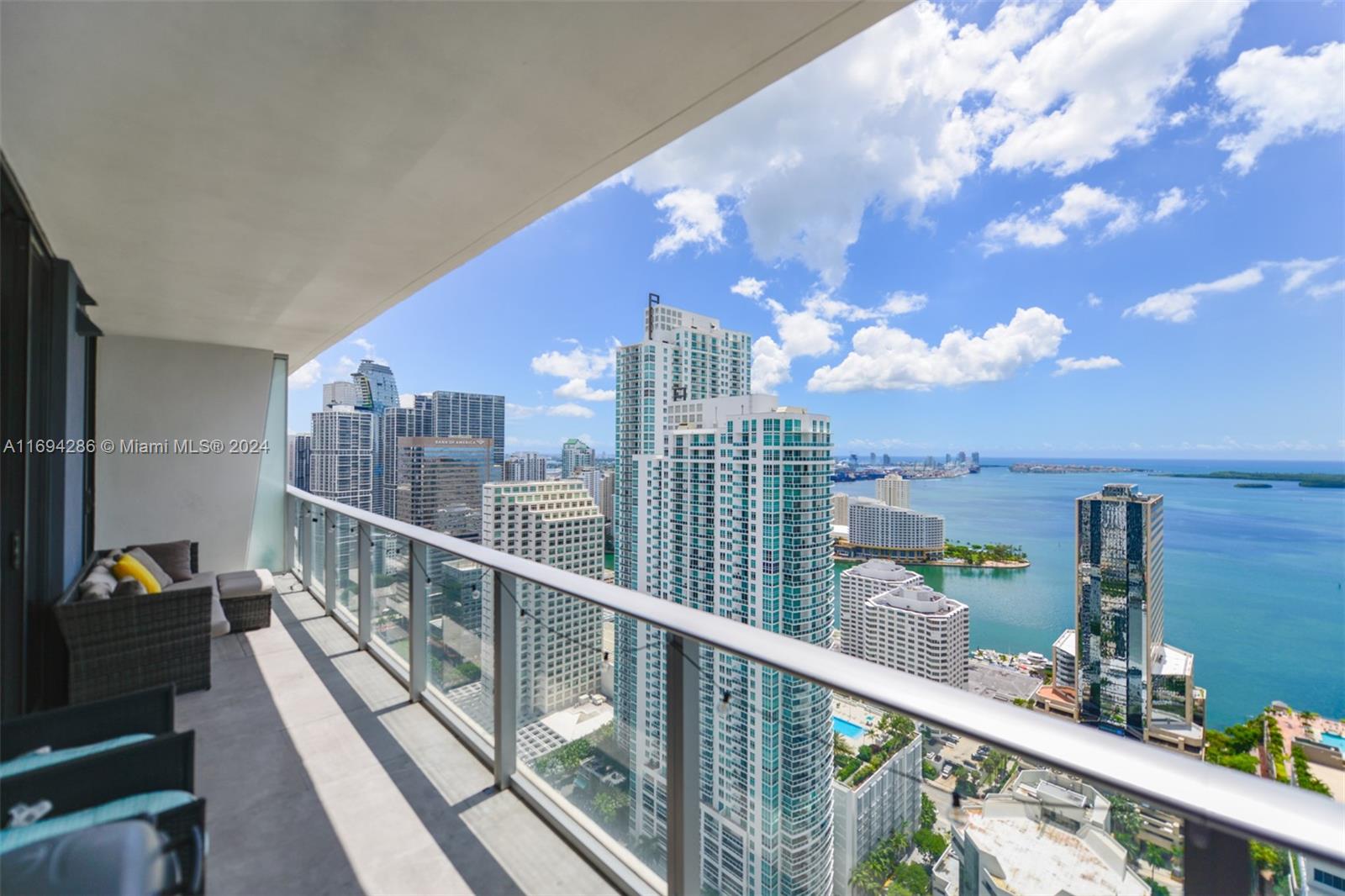 Spectacular unit at the iconic 1010 Brickell Condo. Great floor plan with 1,283 sqft, 2 beds, 3 baths, plus a den, high ceilings, huge balcony with stunning water & city views, semi private elevator, custom made window treatments, top of the line Smeg appliances, 2 PARKING space & more! Building offers: outdoor movie theatre, restaurant & swimming pool @ 50th floor roof top; Co-ed Hammam spa w cold & hot Jacuzzi, massage & treatments rooms, sauna & steam room; basketball & racquetball courts, running track, indoor heated swimming pool, fitness center, party room w kitchen, open terrace & barbeque, kids room w bowling, virtual golf, among others. Excellent location next to public transportation, Brickell City Centre, & more.