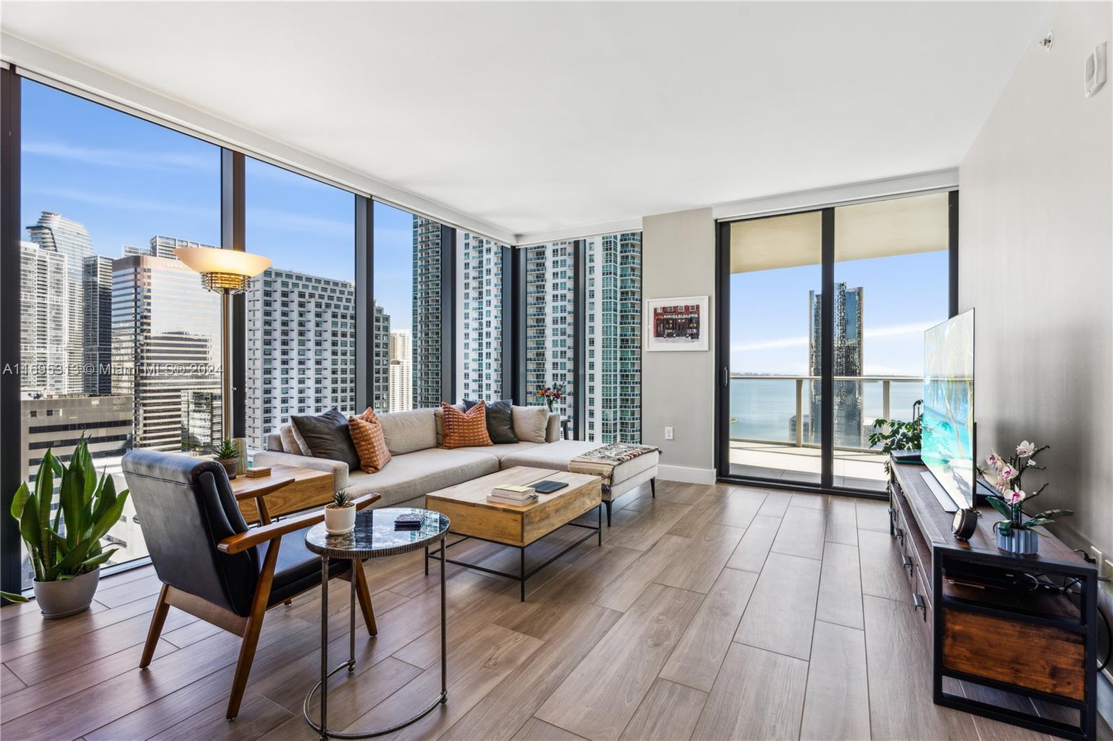 Welcome to this NE corner unit in the coveted 01-line of 1010 Brickell, offering nearly 1,800 SF of versatile living space, enhanced privacy, and resort-style amenities. The floor-to-ceiling glass frames 
within the residence offers panoramic views of the city skyline and Biscayne Bay. The thoughtful layout includes private elevator entry, a primary suite on the east wing, and two bedrooms plus an oversized den with an ensuite bath on the west wing—ideal as a fourth bedroom, office, or media room. Located in the heart of Brickell, you can enjoy premier dining, shopping, and entertainment steps away. 1010 Brickell is renowned for its resort-style amenities, including a rooftop pool, fitness center, spa, indoor pool, jogging path, kids’ playroom, arcade with a bowling alley, and much more.