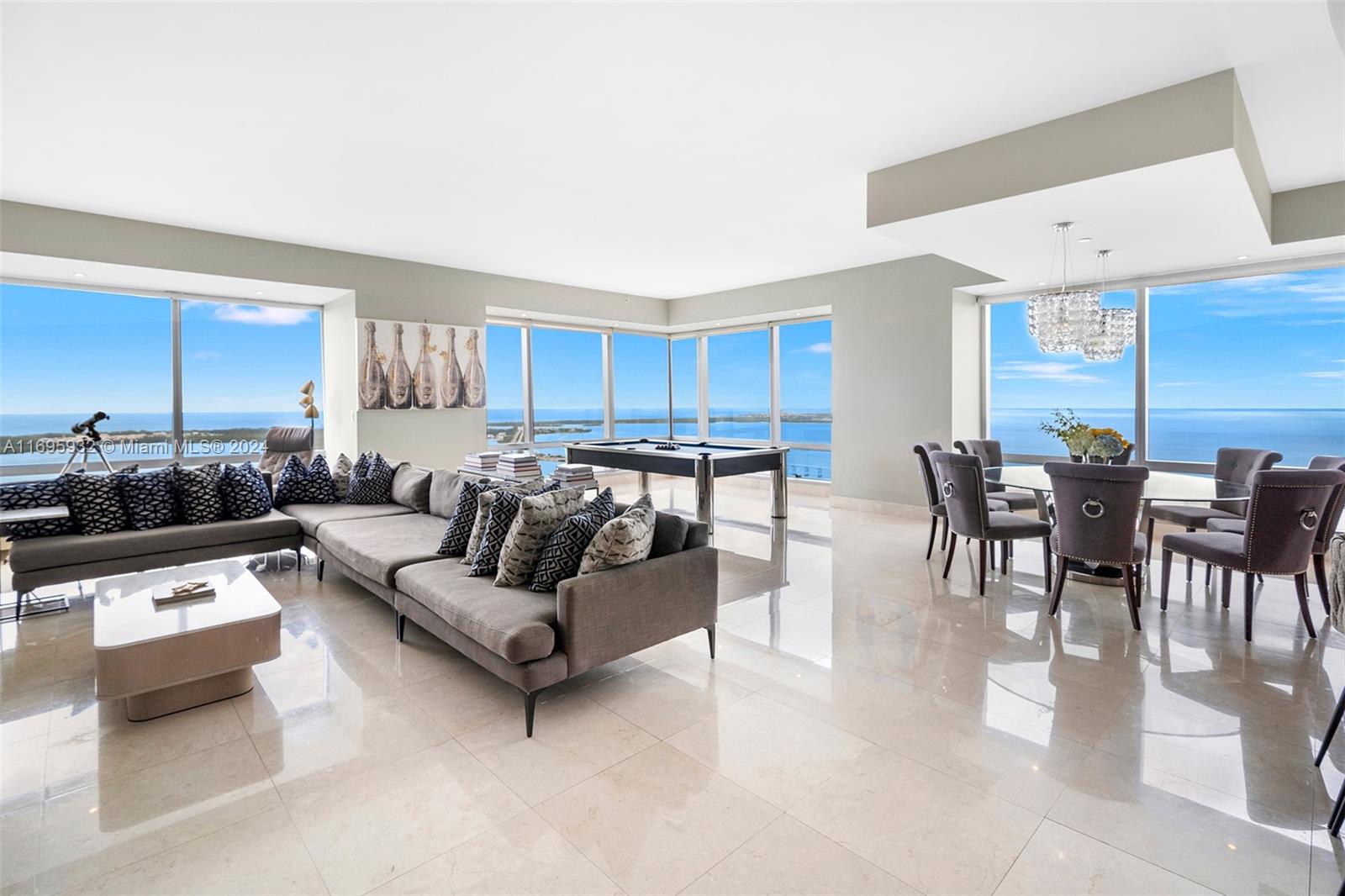 This stunning southeast corner residence on the desirable F line showcases a fantastic layout with 3-BD,4.5-BA, and incredible unobstructed views of the Atlantic Ocean, Key Biscayne, Fisher Island, and Miami Beach! Featuring 3,730 SF with impressive floor-to-ceiling windows, entry foyer leading to a grand living space, marble floors throughout, custom eat-in kitchen with top grade appliances, large primary suite with Jacuzzi and separate shower, walk-in closet, all en-suite bedrooms, maid's quarters, 2 private balconies, 2 parking spaces, large laundry room and more! Indulge in the finest 5-star amenities, including room service, 24-hour concierge, valet, and security, all at your fingertips. With access to a sprawling 50,000 square feet gym and spa, as well as an exclusive owners' lounge.