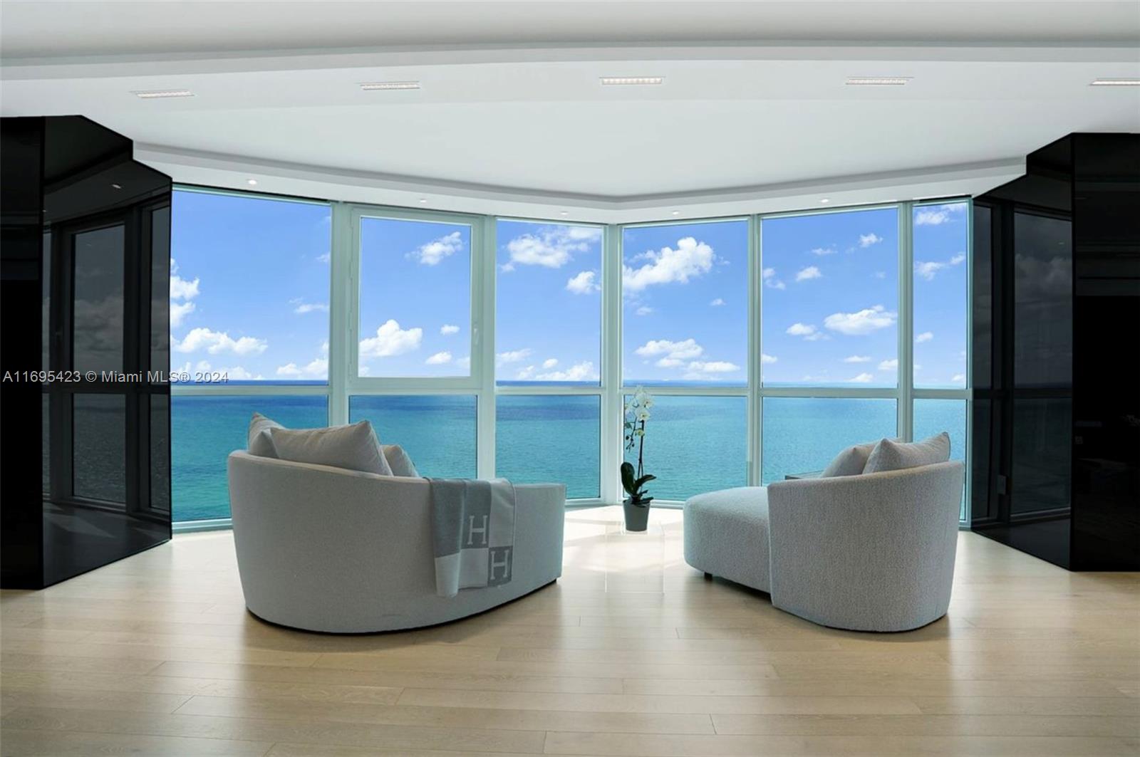 Step Inside With Me! This iconic Setai Skyhome unveils to a 63’ oceanfront main salon with stunning sitting room and TV lounges. Spanning over 6,000 SF, this 4-unit combination floorplan represents the 2nd largest residence in the building where every social area & bedroom offers endless views. The custom reconfiguration includes white oak floors, sleek modern kitchen, tray ceilings, wood paneled millwork, Lutron automation, and marble baths with heated floors. Entertain in style at 2 bar settings and a world class oceanfront 3-row theater. Epic downtown skyline vistas and sunsets are afforded to the dining & family rooms as well as glass encased study/5th sleeping quarter. In the heart of Billionaires Beach, the 5 star Setai offers 3 restaurants, known spa & beach for celebrity sightings.