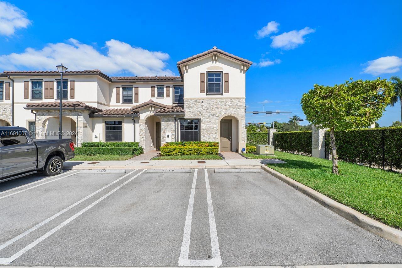 Welcome home! This corner, 2-story townhome in the pet-friendly + gated community of ISOLA boasts: accordion shutters, fenced-in backyard, huge family room off open kitchen, spacious living/dining, all bedrooms are upstairs for privacy, 2 assigned parking spaces & more. As if that wasn't enough: bike, stroll or roll inside your privately enclosed and well-maintained community to dog park, playground, pool, gym or clubhouse; or to shopping, restaurants & more just outside your beautiful community and down the block. Virtually maintenance-free landscaping with front and side yards being maintained via your low HOA fees, and you're also minutes away from the Turnpike and other main roads. Job relocation causes the sale of this recently built in 2020, and purchased from the developer, townhome