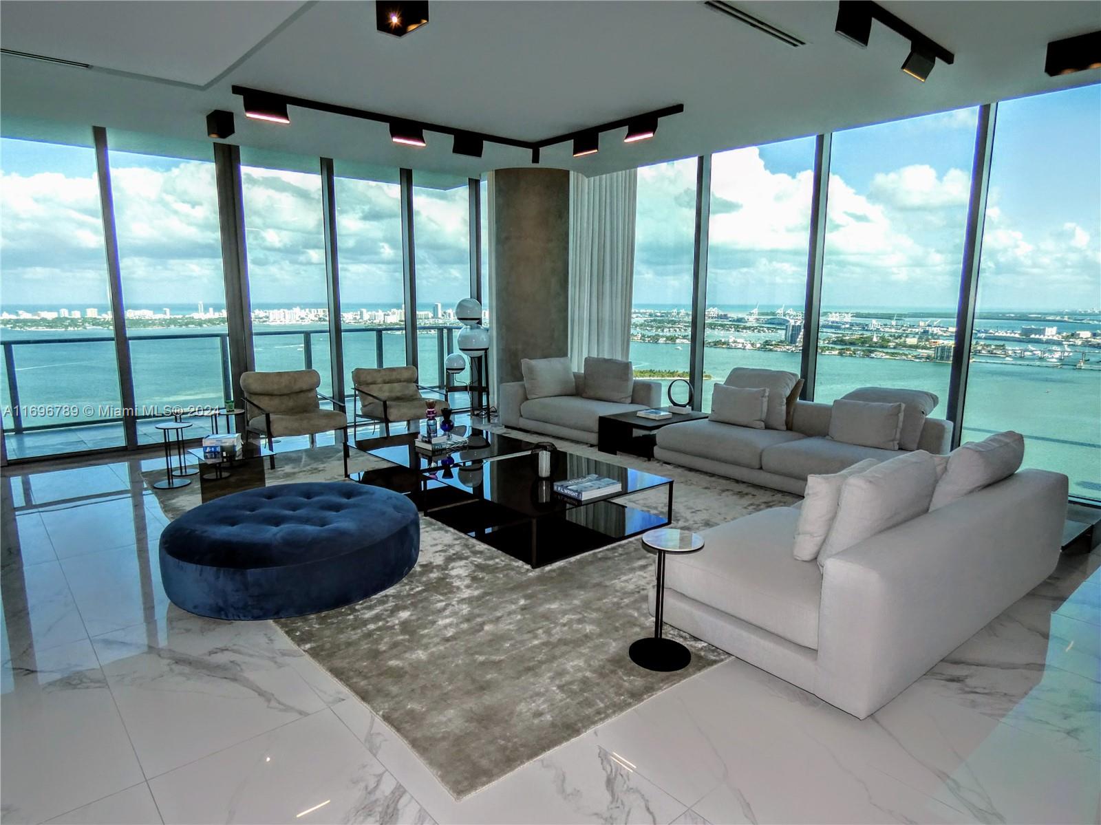 Inquire for SHORT TERM or UNFURNISHED. Stunning luxury building / amenities. Spectacular designer Penthouse 5,500 total sqft. Private elevator 6 bedrooms w/ ensuite baths, 2 primary direct Bay suites! Unobstructed WOW views & privacy! Preferred double south corner with 3 huge balconies. High ceilings. Exquisite Italian designer furnishings and finishes by Addison House throughout except for 3 bedrooms. Enjoy forever views of Miami skyline, South Beach, sunrise & sunsets (even bathrooms have exquisite views) 3 prime garage spaces. Huge storage space. Like paradise: Rare 3 acre resort deck, 3 pools, cabanas, 2 spas, summer kitchen, BBQs, 2 tennis courts, various lounges, secluded areas, movie theater, business center, kids play room, indoor jacuzzi, saunas, massage, gym, yoga, cigar lounge.