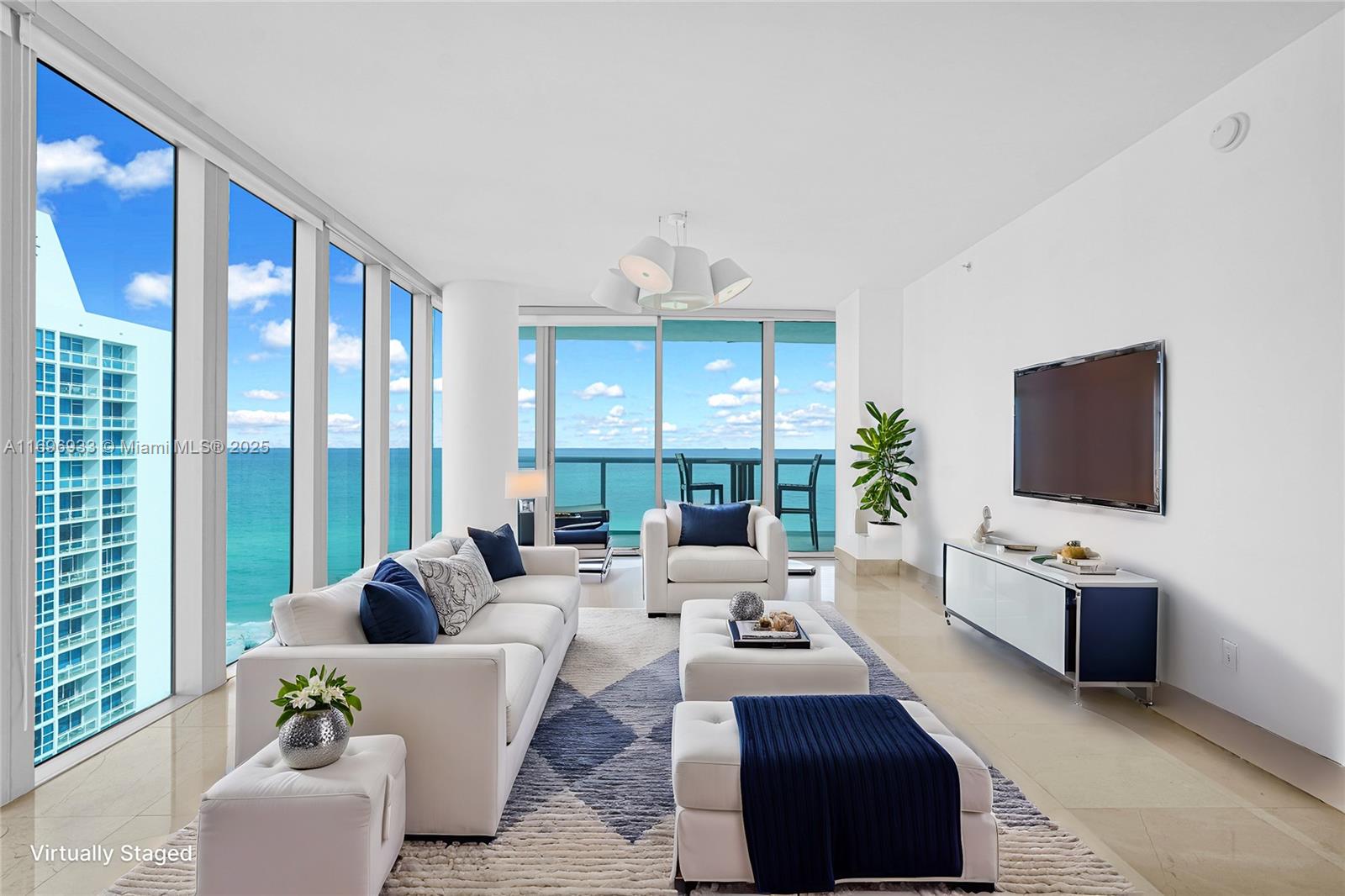 Discover this stunning corner unit in the coveted 02 line, featuring one of the largest two-bedroom floor plans in the building. Located in the South Tower with a north-facing orientation, it offers direct ocean views and abundant natural light. Carillon South sets the gold standard for luxury living with unparalleled amenities, including direct beach access, four pools with cabanas and beach service, a world-class spa, a state-of-the-art fitness center, and wellness programs. Residents enjoy a signature restaurant, café, boutique, beauty salon, party room, 24-hour concierge, and valet, creating the ultimate Miami Beach lifestyle.