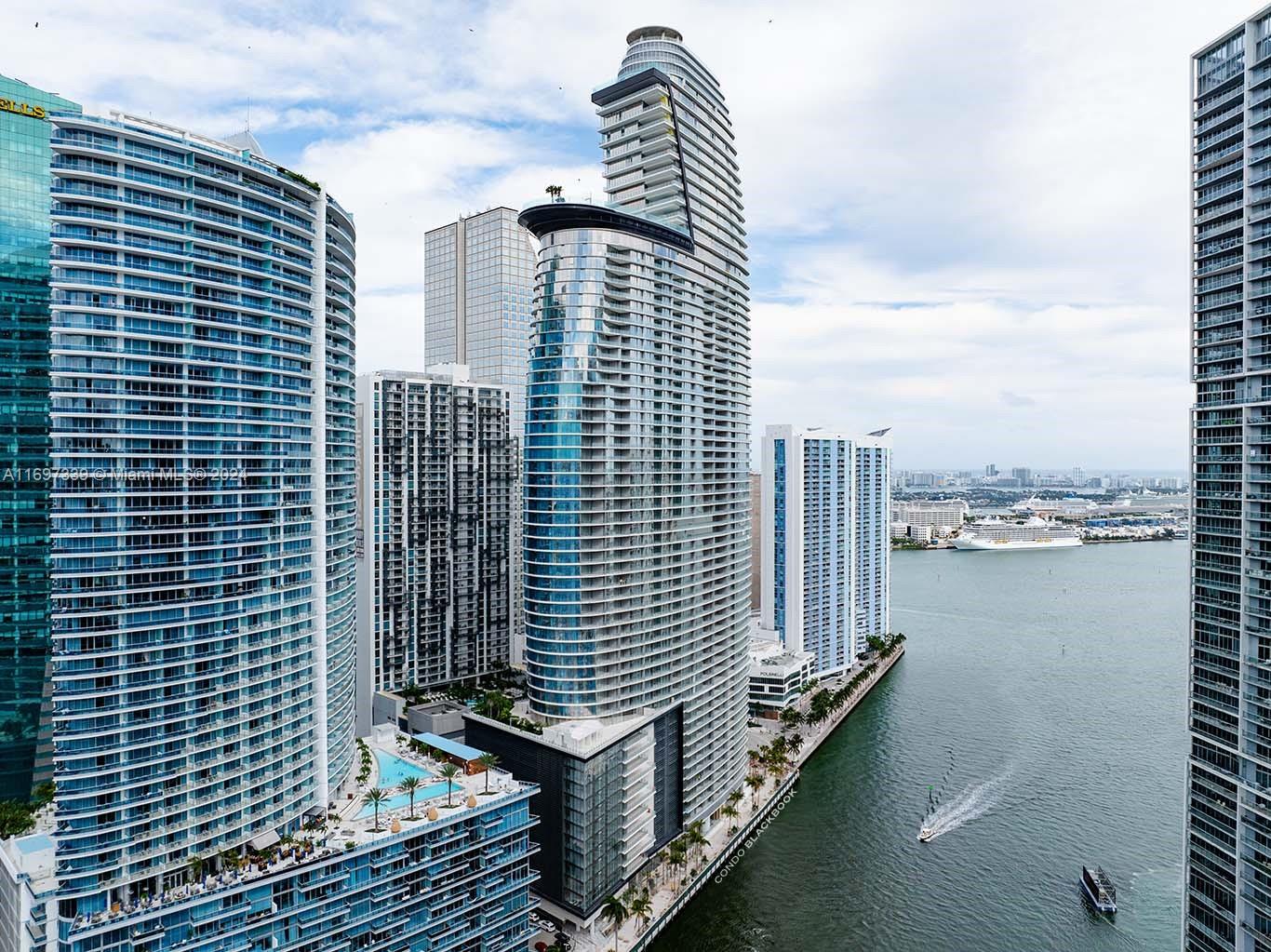 Amazing panoramic view from the 42th floor. This 3-bedrooms and 3.5 baths unit. Located in a prime spot, this iconic tower soars over the Miami River and city, exquisite craftsmanship is showcased throughout, floor to ceiling panoramic views through impact glass to the impressive use of marble thought-out. Each detail radiates luxury and quality. The amenities are unparalleled, a sprawling pool deck, an open living/dining area with breathtaking Miami views, a cutting-edge two-level gym, a lavish spa, theaters, an art gallery, and an indoor swimming pool. Butler Concierge Services.