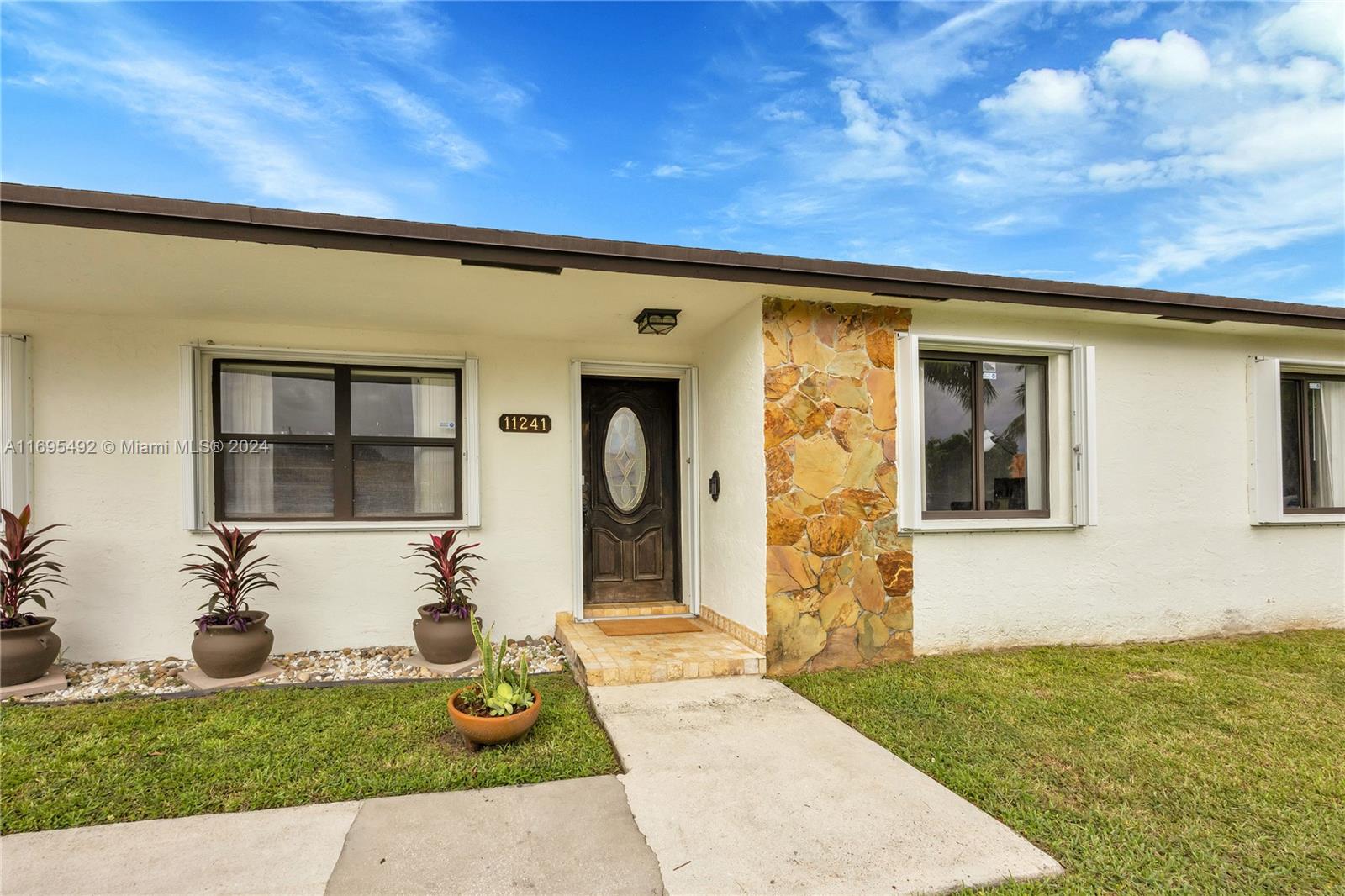 Sidewalk-lined street in a family friendly and conveniently located neighborhood close to community parks, A-rated and magnet schools, shopping, entertainment venues, easy access to turnpike and US1. Built in 1990, this 3/2, 2,468 sf living area, 7,500 sf fenced lot with 1-car garage features large comfortable social spaces with formal living room, large dining area and family room that can be converted to 4th bedroom, sunroom off dining area with glass doors to backyard patio, updated baths, huge master suite with walk-in closet.  Newer roof, interior laundry room, full coverage accordion shutters, updated and expanded electrical panel, room for a pool, backyard shed and no HOA!  All improvements and additions permitted.