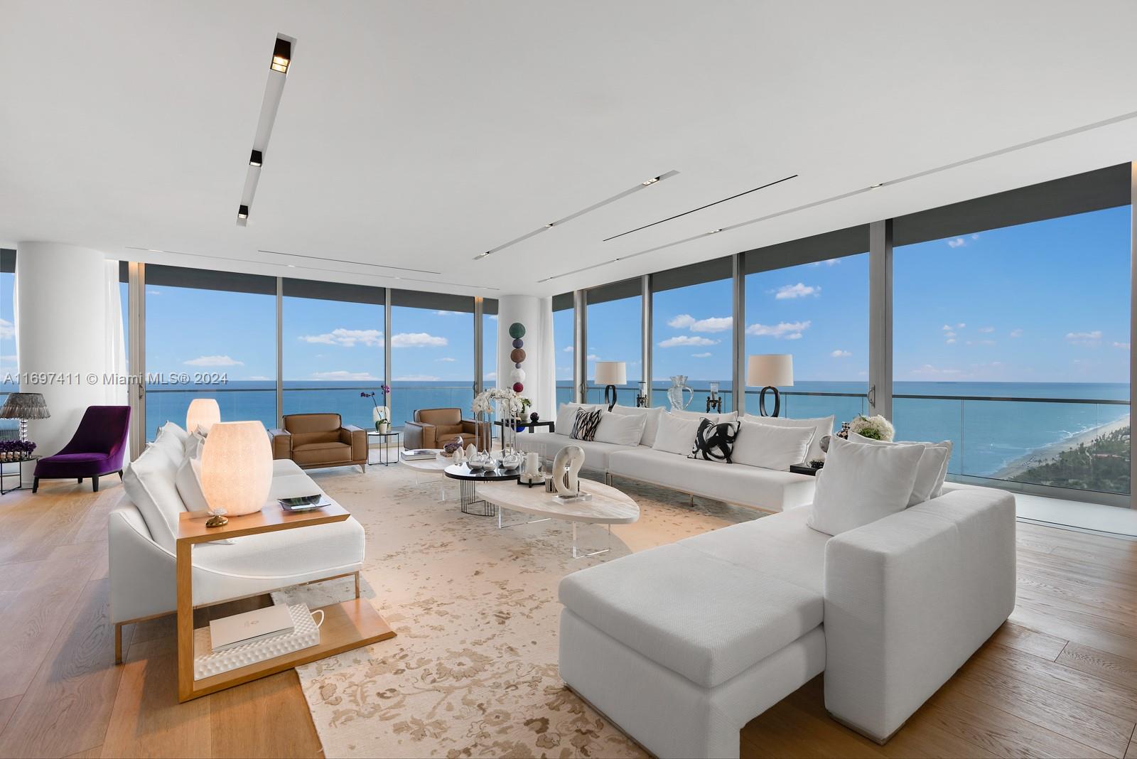 The pinnacle of luxury oceanfront living, this immaculate residence is comprised of 2 units spanning nearly 10,000 SF of interior and exterior space. Encased in floor-to-ceiling glass overlooking the Ocean, Bay & rare unobstructed South facing views with an open Downtown skyline, the flow-through residence features soaring ceilings with 3 BD plus office, 4 BA & 2 HBA. Private elevator entry foyer with custom orchid wall opens up to generous interiors with rare Italian oak flooring. Waterfront primary suite showcases 2 boutique-style dressing rooms & spa-inspired primary bath with soaking tub. Additional features include Gourmet kitchen, entertainment bar, Ornare walk-in closets, temp-controlled windows, Crestron smart home automation, laundry room, ample storage, 4 parking spots + valet.