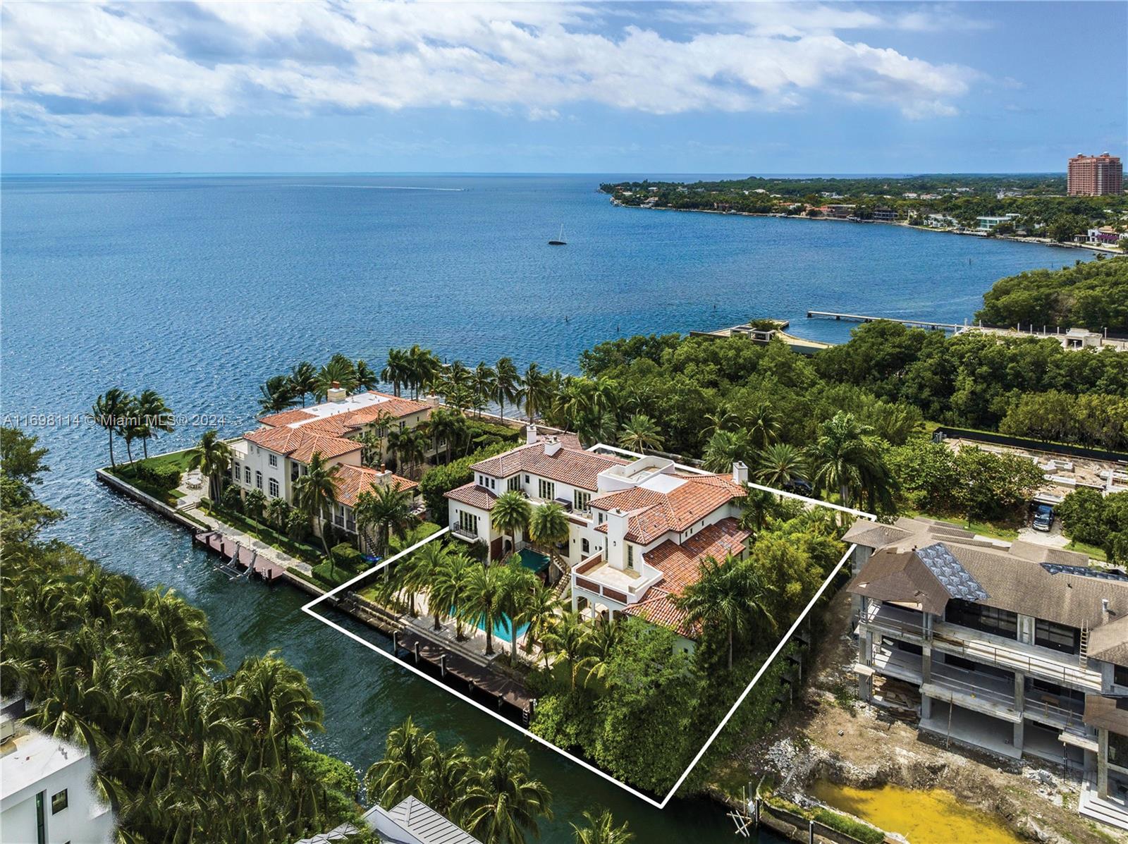 Located in the private guard-gated community “The Moorings”, this enchanting 17,873 total SF waterfront estate is in the heart of the most sought-after neighborhood in Coconut Grove. Every detail of the 7 BD/7+2 BA home was carefully selected and quality crafted. Multiple covered terraces provide a seamless blend of indoor and outdoor spaces with endless water views. A gourmet eat-in kitchen offers an exquisite, oversized island and top-of-the-line luxury appliances. The elegant primary suite features a sitting room, walk-in closets, and a spa-like bathroom retreat with a roman tub and fireplace. On 143 ft of waterfront, the home includes a pool, dock, direct access to Biscayne Bay, and a rooftop terrace with views of the Bay. In close proximity to the finest dining, shopping, and schools.