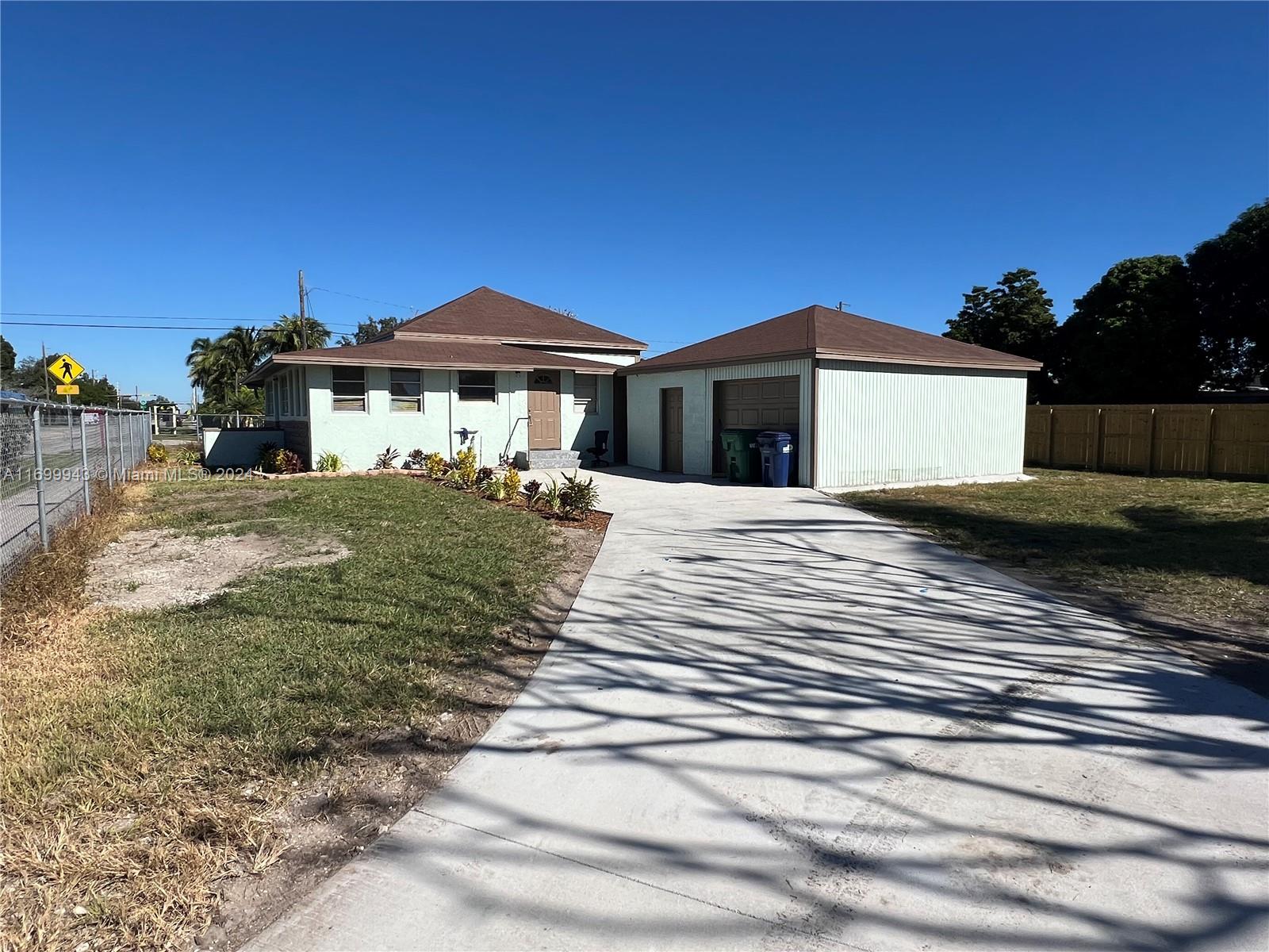 Tastefully renovated. This 4 bedroom, 2 bathroom house is ready for a new family! Park your boat, RV, and or build a pool with a nice tiki hut!! Oversized corner lot, No HOA, No CDD, no neighbors on two sides! The garage was converted into a 2 bedroom 1 bathroom with kitchen efficiency/apartment, currently rented for $1800 a month. The main home is also rented for $2800 a month! Property currently brings in $4,600 monthly!!