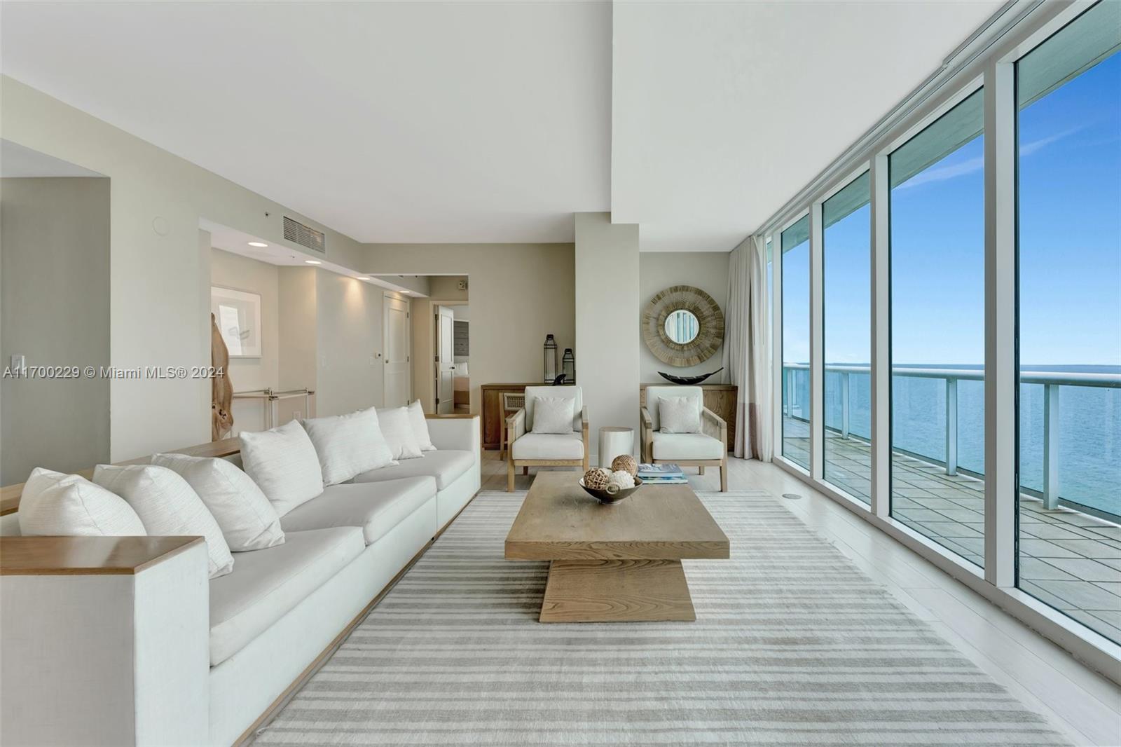 Step into this elegant two-bedroom, two-and-a-half-bathroom penthouse, where an open-concept living and dining space welcomes you with sophisticated design, plush furnishings, and floor-to-ceiling windows that frame mesmerizing ocean views.  

The primary suite offers a serene retreat with a king-sized bed, flat-screen TV, and a spa-inspired en-suite bathroom, perfect for unwinding. A private  wrap around balcony provides a tranquil space to savor the unobstructed ocean views while the resort’s world-class amenities, including a fitness center, heated pool, and exceptional dining options, enhance your living experience.  

Don’t miss this rare opportunity to own a luxurious sanctuary in one of South Florida’s most desirable beachfront destinations.