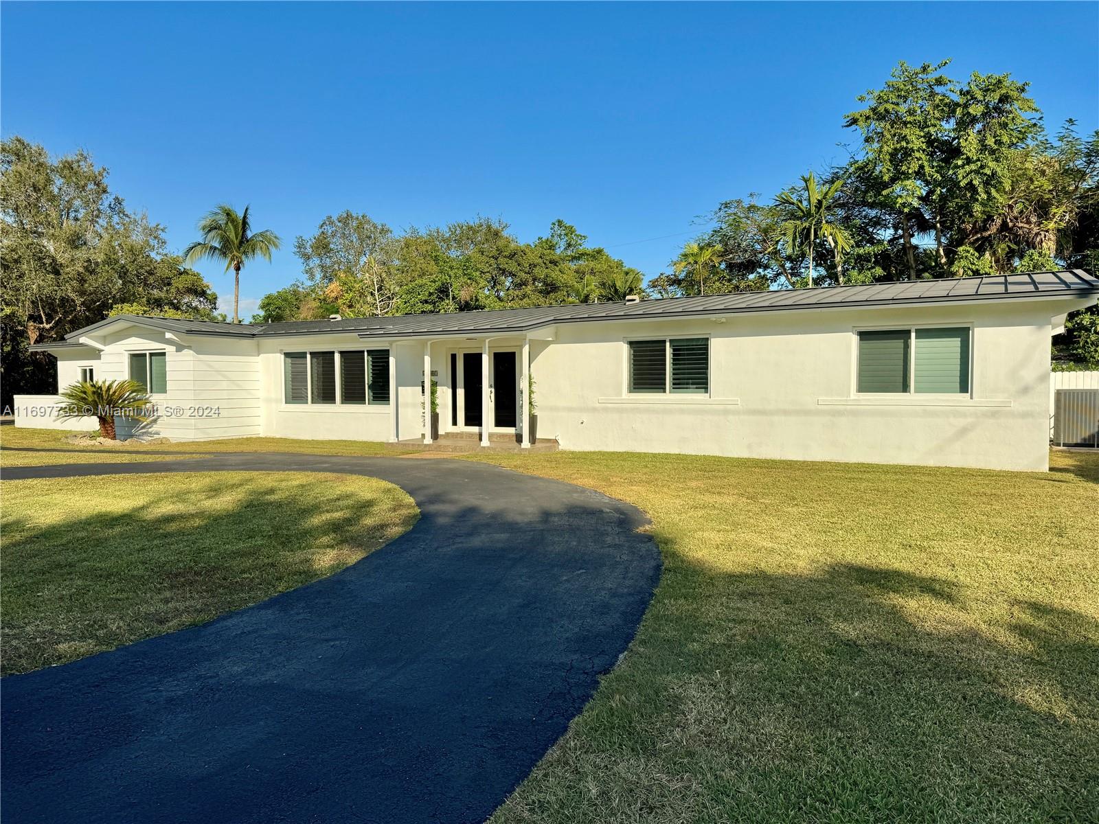 Hands down, the BEST VALUE IN PINECREST! Rock-solid corner lot home with several bonus areas, all legal. Meticulous owner spent 37 loving years here. 8 year old metal roof, impact windows and doors, Replaced/sleeved pipes with lifetime warranty, new A/C, brand new kitchen appliances, resurfaced pool, updated kitchen and baths, brand new plantation shutters. The bonus rooms include a separate bedroom or office accessible off the covered pool deck. The separate entry “garage” was rebuilt as a huge 20x18.5-foot utility room. You can reconnect this room easily. Screened pool for blissful bug-free enjoyment year-round. Great schools. Easy access to The Falls Mall, public transportation and a world of places to eat and shop.