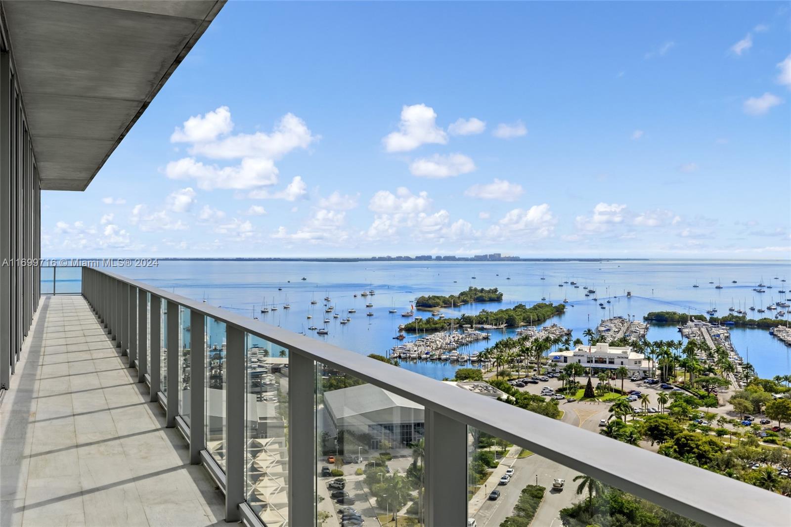 Experience luxury and sophistication in this breathtaking 5-bedroom, 5 1/2-bathroom residence at the exclusive Grove at Grand Bay. Offering expansive views of Biscayne Bay, downtown Miami, and the lush greenery of Coconut Grove. This home features a customized floor plan with high ceilings, floor-to-ceiling windows, and upgraded selections throughout. The gourmet kitchen is equipped with top-of-the-line appliances, custom cabinetry, and sleek marble countertops. The primary suite offers a serene retreat with a generous walk-in closet, and a spa-like en-suite bath with a soaking tub, separate shower, and dual vanities. The four additional bedrooms are equally impressive, offering ample space and ensuite baths. The Grove at Grand Bay offers world-class amenities, 24-hour concierge, valet.