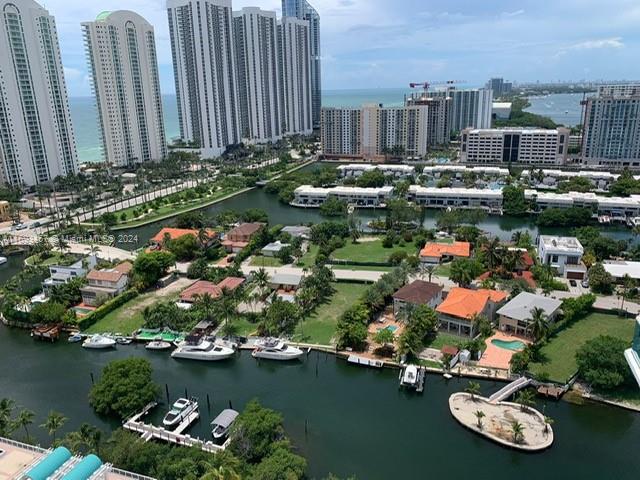 Amazing water & city views from this Stunning CUSTOM (only 6 units like this in the Bldg) TRULY 4 BDRMS w/3 FULL BTHRMS + a HUGE WRAP-AROUND balcony accessible from every room. 2,384 SF of Living Area, floor to ceiling glass panels/sliding doors throughout making it super bright. ALL SNAIDERO-Brand kitchen cabinets & bathrooms' vanities. EXTENDED KITCHEN CABINETS w/CUSTOM HUGE PULL-OUT PANTRY. Formal Living, Dinning & Breakfast Areas, 24"x24" marble floors THROUGHOUT (NO CARPET!), Black-outs in all Bdrms, Electrics in Mst Bdrm; Roller Shade Screens throughout, plenty of custom-made closets European light fixtures included. E & manual hurricane shutters throughout. 3 assigned & covered Parking spaces (YES THREE!) & big A/C'd storage bin. Beach Club with chairs/umbrellas, huge gym & salon.