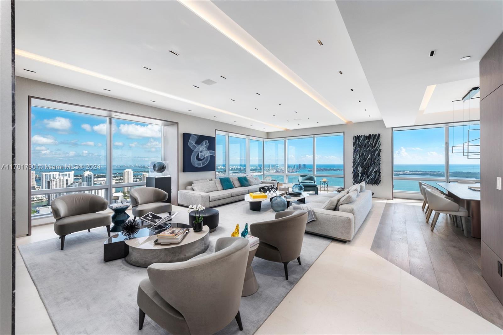 Stunning Four Seasons Residence on the 59th floor, offering panoramic, unobstructed views of Biscayne Bay, the Atlantic Ocean, the City of Miami, Key Biscayne, & Fisher Island. This rare combined E/D unit spans 4,471 square feet and features impeccable high-end finishes throughout. Highlights include a wine cellar perfect for connoisseurs, & a gourmet kitchen equipped with top-of-the-line appliances. The luxurious master suite boasts endless water views, a spa-like en-suite bath with a separate shower & tub, & a spacious walk-in closet. Enjoy exclusive access to 5-star amenities, including 2 heated pools, poolside cabanas, owner’s lounge, & membership to Equinox fitness, and full-service spa. Additional services include 24-hour valet parking and full-service concierge. No Artwork Included.