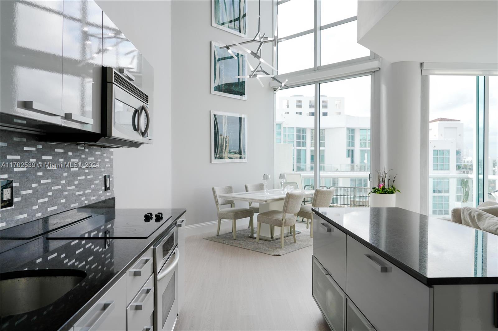 This gorgeous 2 story remodeled Penthouse in the heart of Aventura offers 2 bedrooms plus a den, 2.5 bathrooms, high ceilings and natural light with panoramic views. The den is very spacious and can be made into a 3rd sleeping room. Remodeled with high end finishes/fixtures throughout - making this a 1-of-a-kind masterpiece for sale in the sought after Atrium building! No expense was spared in upgrading every inch of this unit, from lights and accent walls to backsplash and glass railings. 2 assigned and convenient parking spaces near the elevator, and large storage room near parking spaces. Panoramic view of the Aventura. High floor, a lot of sun gives an advantage against mold!