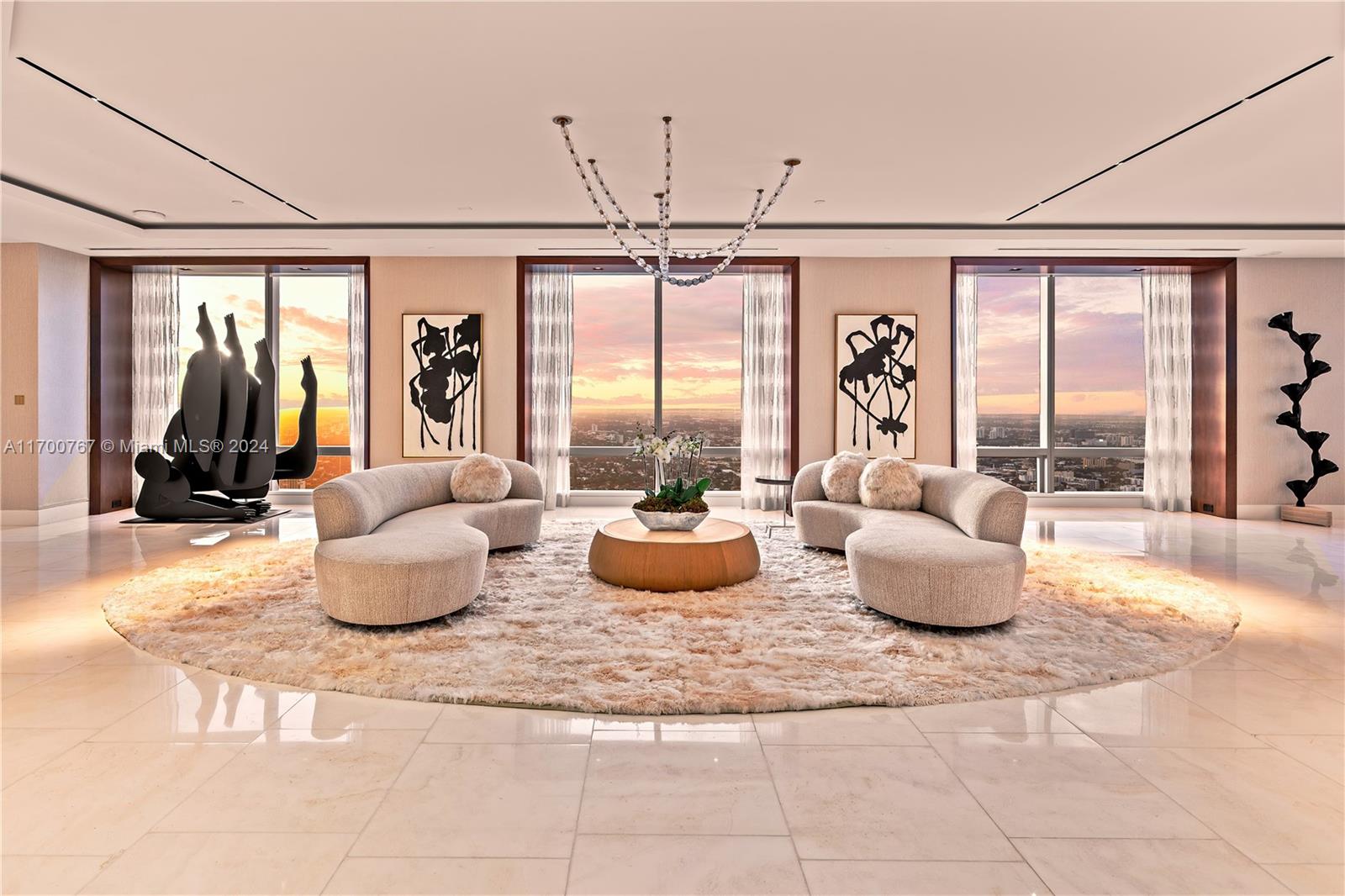 Experience five-star living high above Miami on the 70th floor of the Four Seasons Brickell. This sky-high estate combines three penthouses into one exquisite masterpiece, featuring Amadi Designer Millwork, an onyx bar, and two expansive living areas framed by floor-to-ceiling windows that showcase breathtaking bay views and sunsets. The Italkraft chef’s kitchen is a culinary dream, while the primary suite offers a sitting area, two oversized closets, and a grand bath with a showstopping shower. Residents enjoy unmatched amenities, including concierge, valet, room service, pools, cabanas, a private lounge, Equinox fitness and spa, and on-site fine dining.