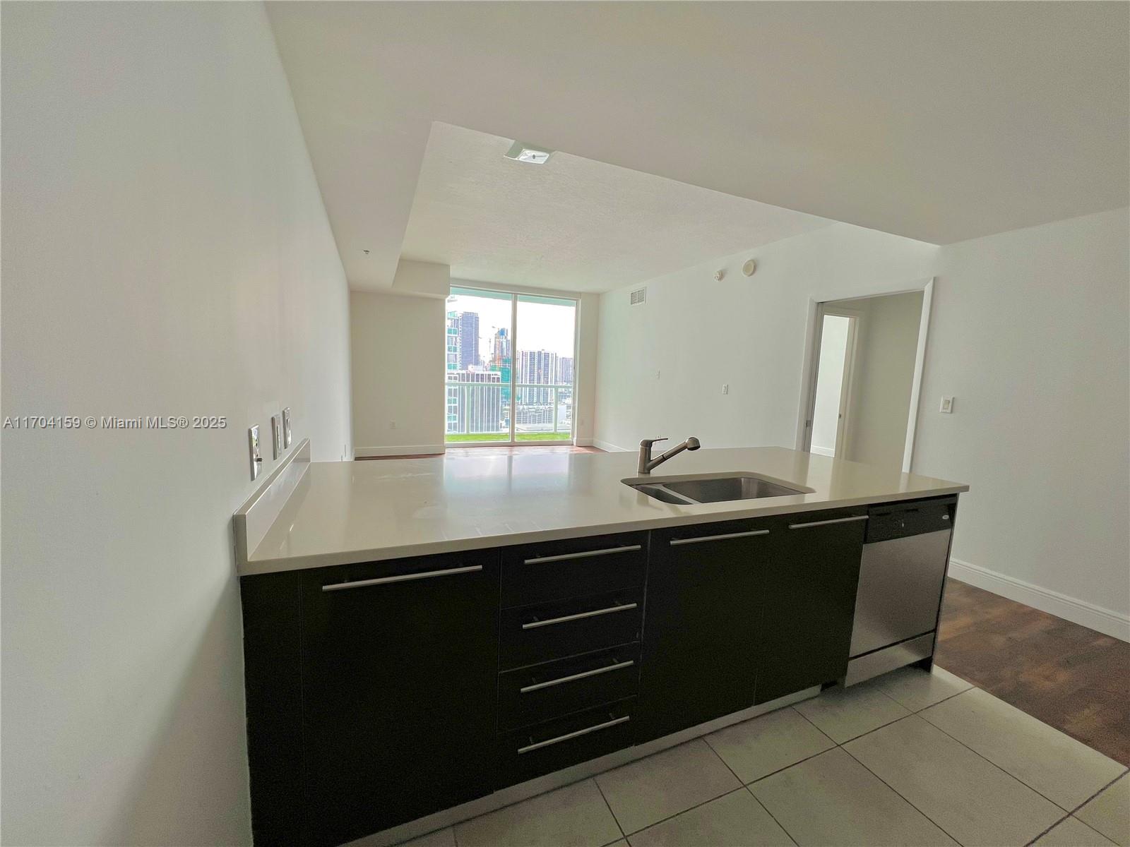 Gorgeous 1 bedroom 1 and 1/2 bathrooms in Quantum on the Bay!  Tile and Vinyl floors.  Washer and Dryer in unit.  Beautiful city and bay views!  Walking distance to Performing Art Center,  Museum Park and Bayside Mall.   Building has great amenities such as two pools, Fitness Center, Media Room and much more!