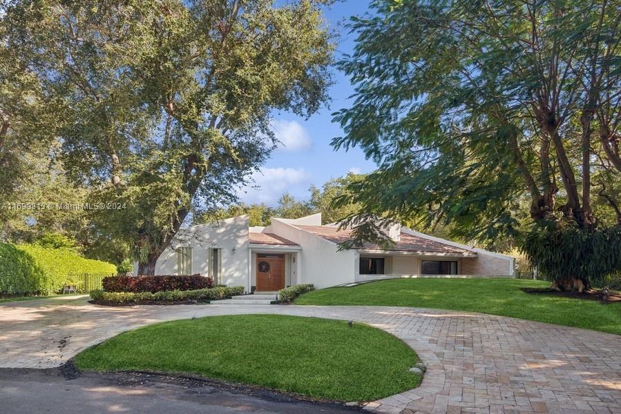 Located in the Prestigious, Guard-Gated Community of Cocoplum, this beautifully renovated one-story home sits on an oversized lot of 24,767 sq. ft. with 5,321SqFt of Living space. The living area with an open concept layout is filled with natural light, high ceilings and large windows. The property features 6 bedrooms, 7 baths, a very spacious primary suite with large walk-in closets, beautiful modern Spa-like bath. Wonderful covered terrace and pool, perfect for entertaining. Full-house generator. Also features a two car garage.
Voluntary Association membership.
