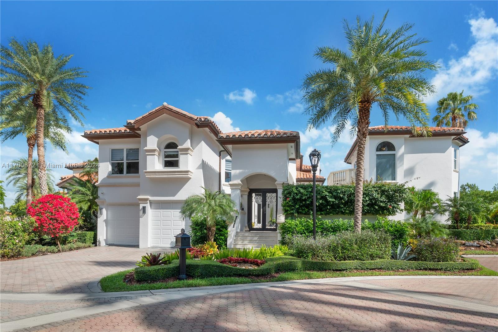 Premiere Private Country Club living in Coral Gables with gated community and full time security. Updated home combines luxury, elegance, comfort, & convenience. A very special home with a first-class 18-hole championship golf course & a deep-water marina. Exclusive living a short drive to downtown Coral Gables, Coconut Grove, MIA & all that Miami offers. The main residence features four en-suite bedrooms, including a stunning second-floor primary suite & a private balcony. Natural light throughout the home. Main-floor terrace provides a perfect setting to entertain & relax. Separate guest house adds an additional bedroom, 1-bathroom, exceptional comfort. Courtyard & a sparkling pool connects the two homes. Prime end lot next to golf course, furnished, peaceful bay breezes, gorgeous views.