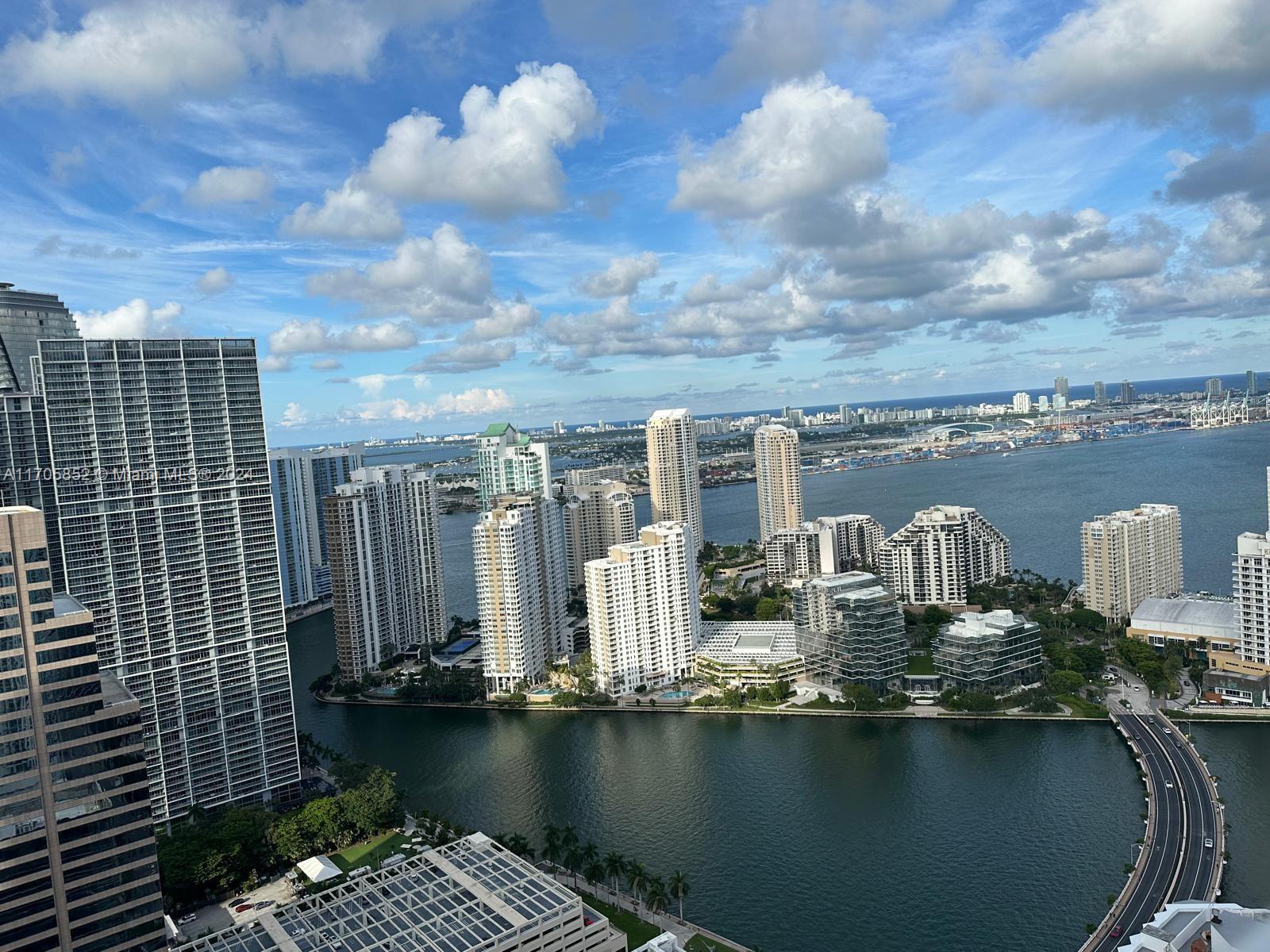 BEST VIEW. LOW HOA, FINANCING AVAILABLE - Experience luxury living in this stunning 2-bedroom, 2-bathroom sky-high retreat, breathtaking water/city views from the 48th floor. Nestled in the heart of Brickell, it is a walker's paradise: Brickell City Center (5 MIN WALK), banks (2MIN), restaurants (3 downstairs), 5 MIN walk to the Brickell attractions, and Brickell Key walk path. Revel in the elegance of higher ceilings and upgraded stainless steel appliances, stackable washer and dryer, complemented by chic wood flooring throughout. Unparalleled amenities including 2 pools, jacuzzi, Zen Garden, rejuvenating spa, state-of-the-art gym, relaxing sauna, a theater, a fully-equipped business center and children's room. Low HOA, assigned parking. UNIT REPAINTED, MINT CONDITION. Easy to show.